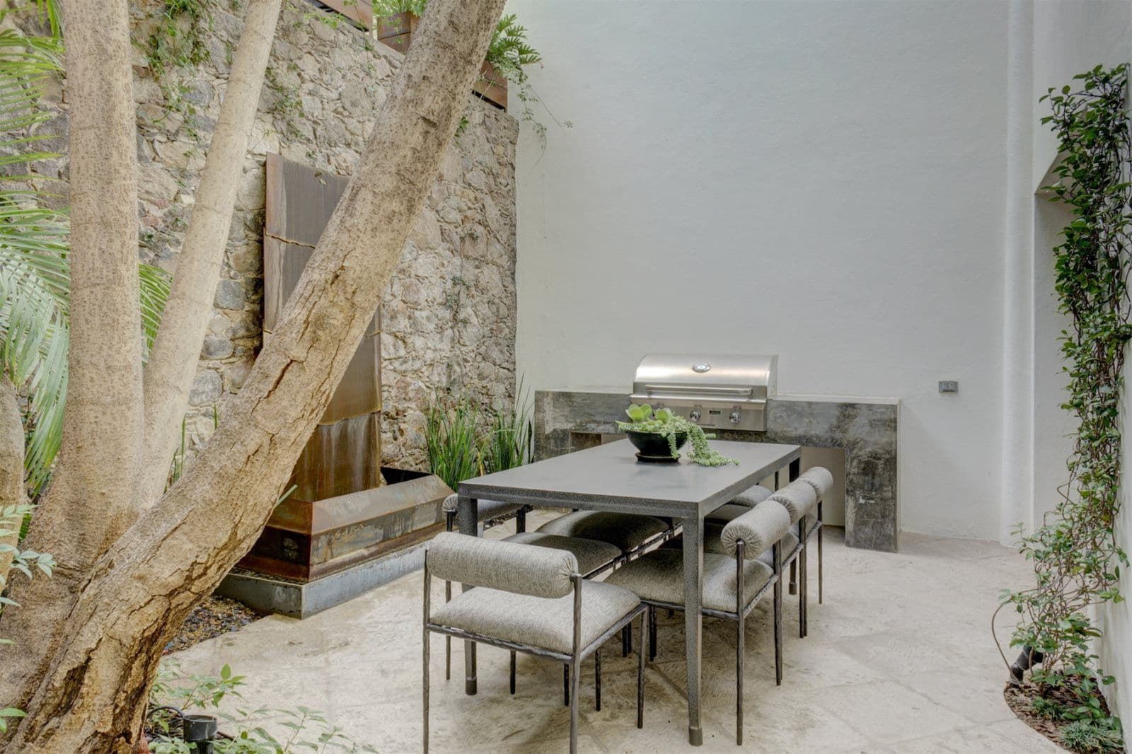 Casa Arcadia — Centro, San Miguel de Allende — photo 8 — sophisticated courtyard with mature trees, dining elegance