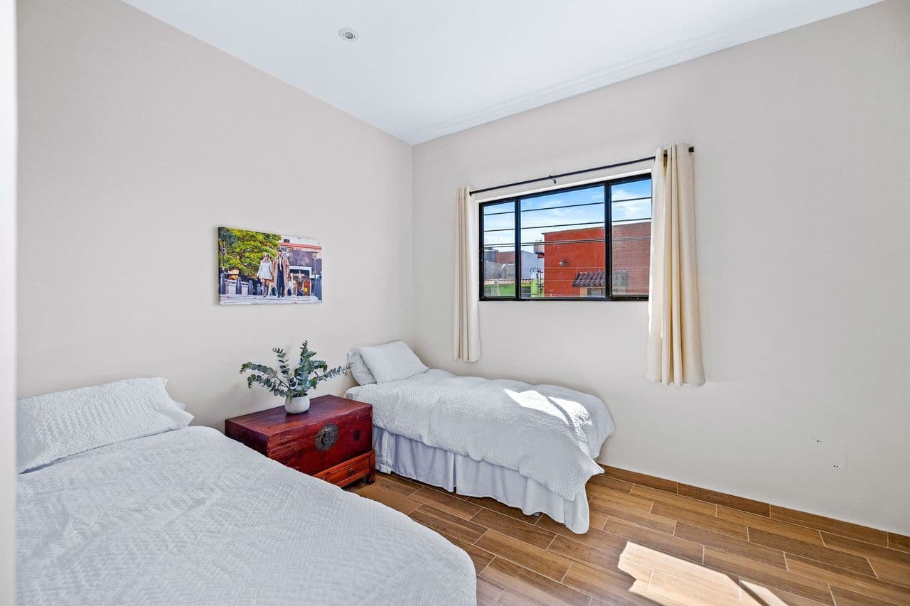 CASAS ANGEL & ANGELITO — La Lejona, San Miguel de Allende — photo 22 — bright twin bedroom, natural light flooded