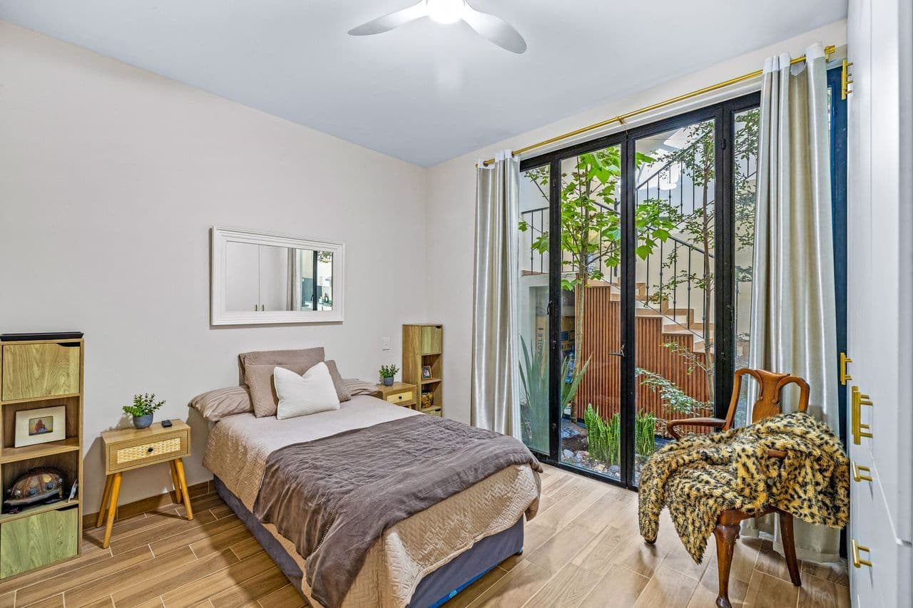 CASAS ANGEL & ANGELITO — La Lejona, San Miguel de Allende — photo 8 — luminous bedroom with private courtyard access