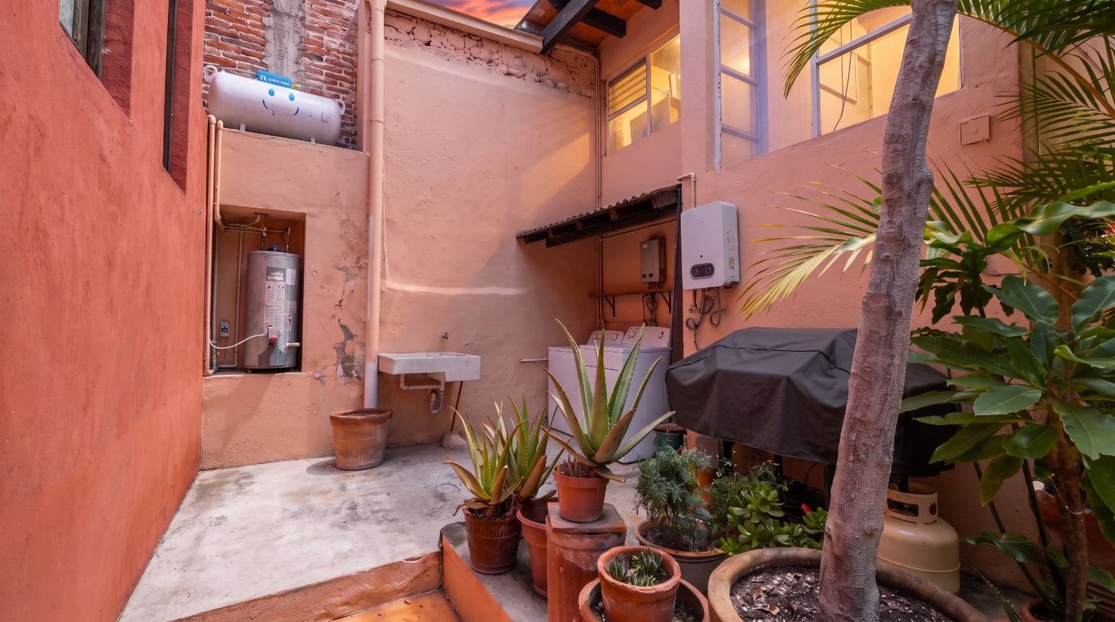 Condo Lelé — Centro, San Miguel de Allende — photo 24 — charming courtyard with golden sunset glow