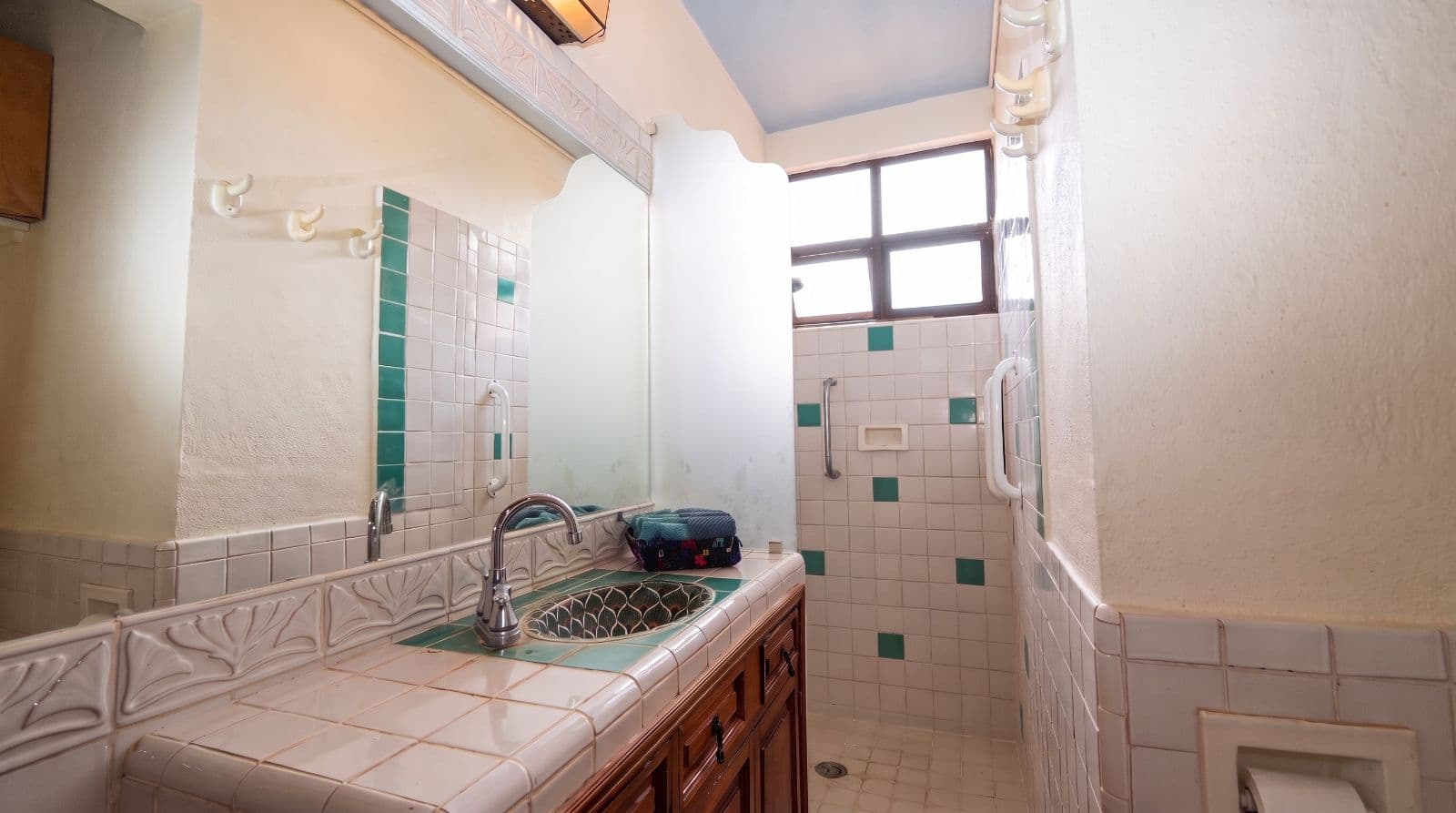 Condo Lelé — Centro, San Miguel de Allende — photo 17 — charming vintage bathroom with abundant natural light