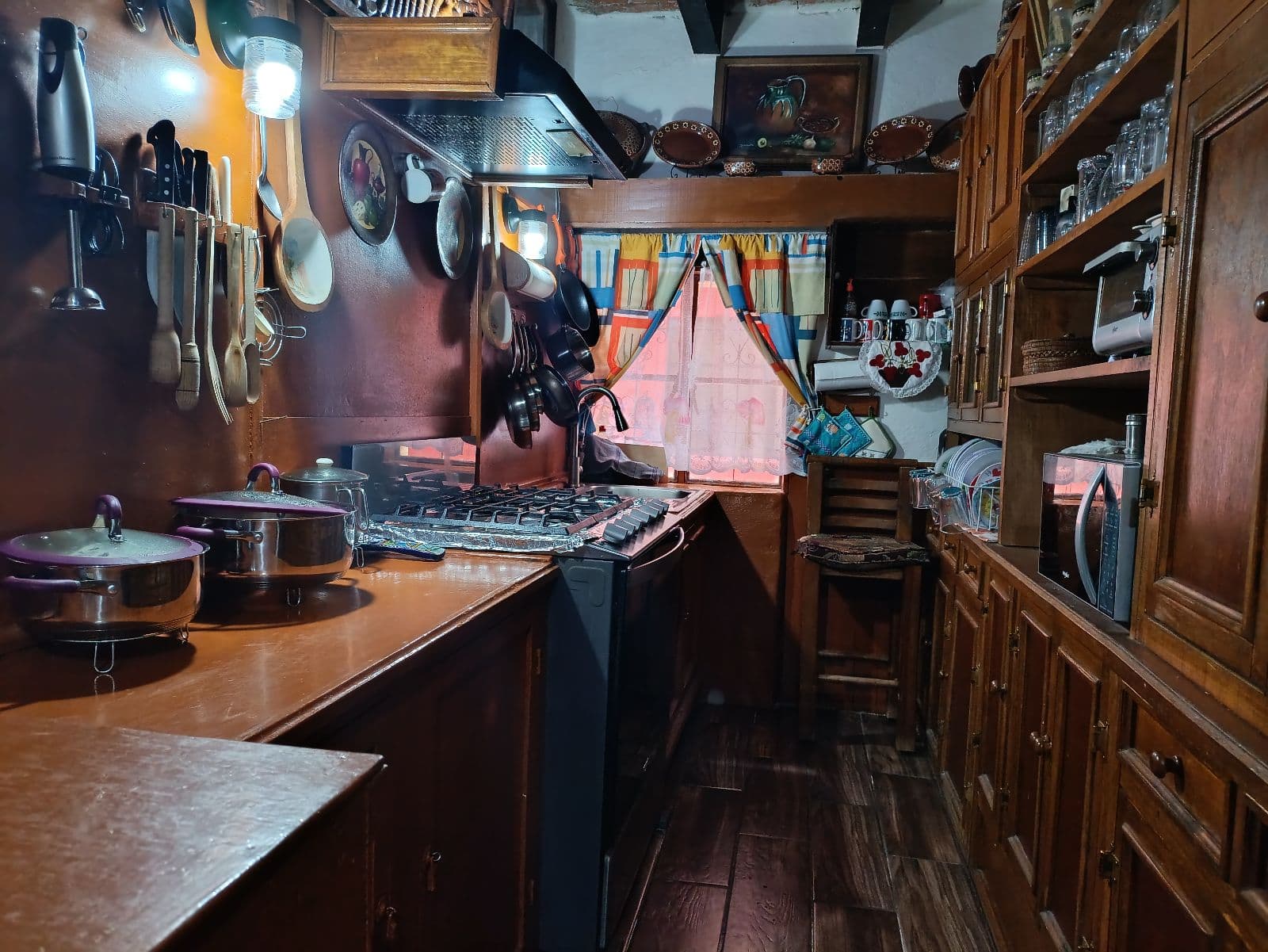 Casa y Casita en el Centro de San Miguel — Centro, San Miguel de Allende — photo 9 — charming traditional mexican kitchen, warmly lit