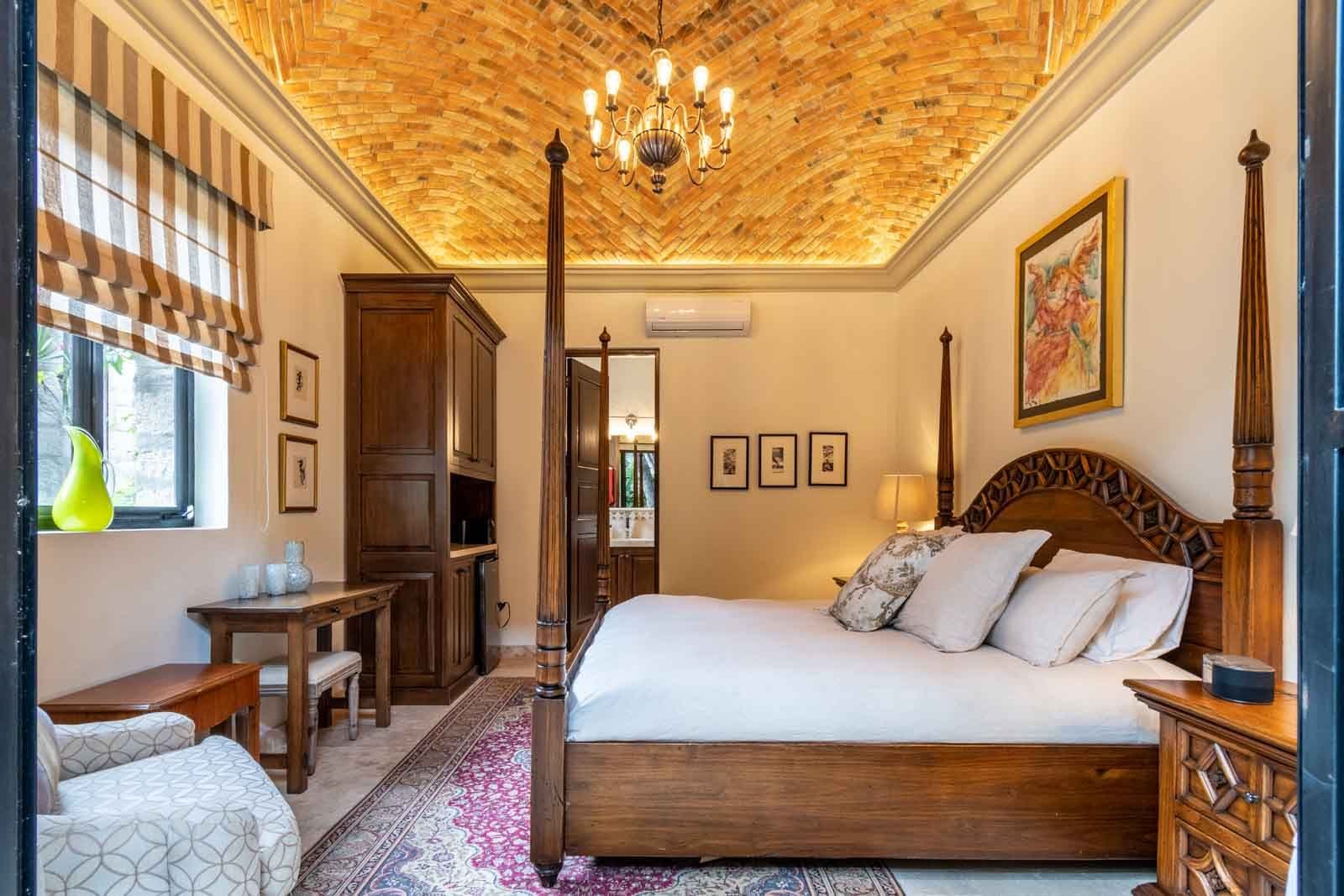 Casa Cosmati — Atascadero (Arcos de San Miguel), San Miguel de Allende — photo 8 — elegant colonial bedroom, herringbone luxury