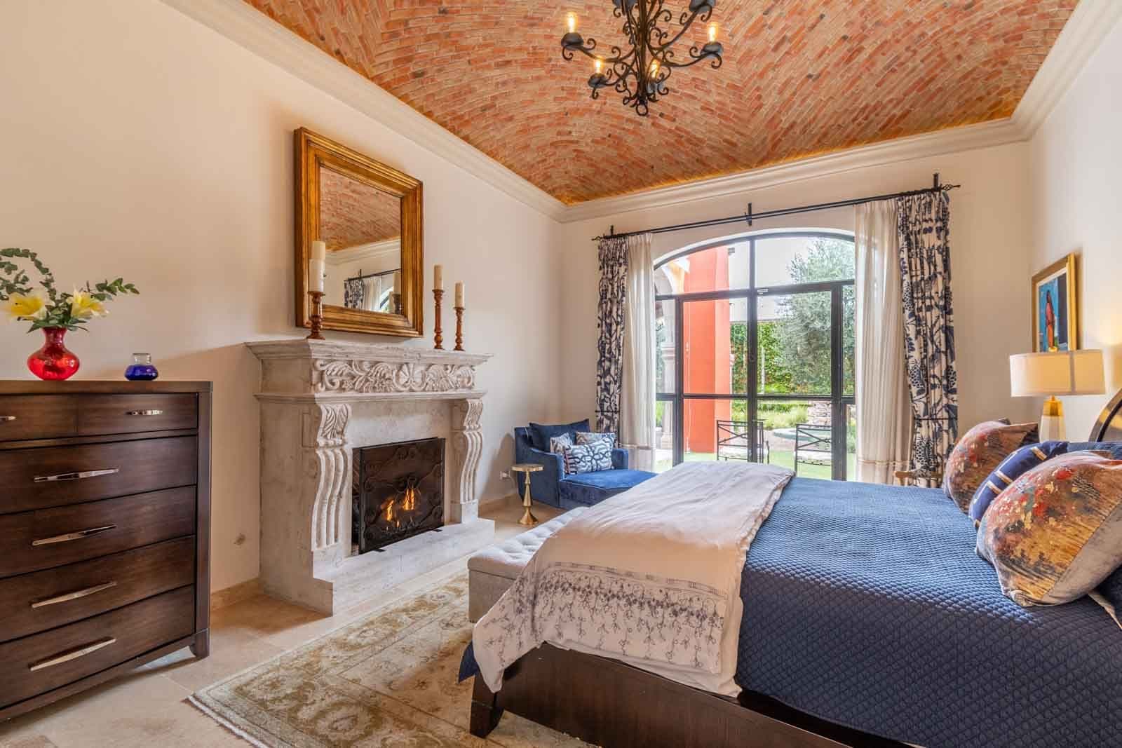 Casa Cosmati — Atascadero (Arcos de San Miguel), San Miguel de Allende — photo 15 — elegant master suite, fireplace, terrace views