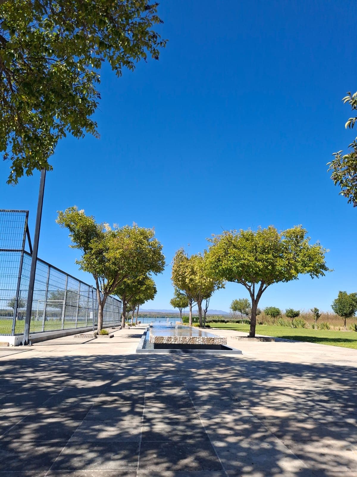 Manzana 7 Lote 46 — Las Campanas, San Miguel de Allende — photo 4 — serene waterfront promenade, mature shade trees