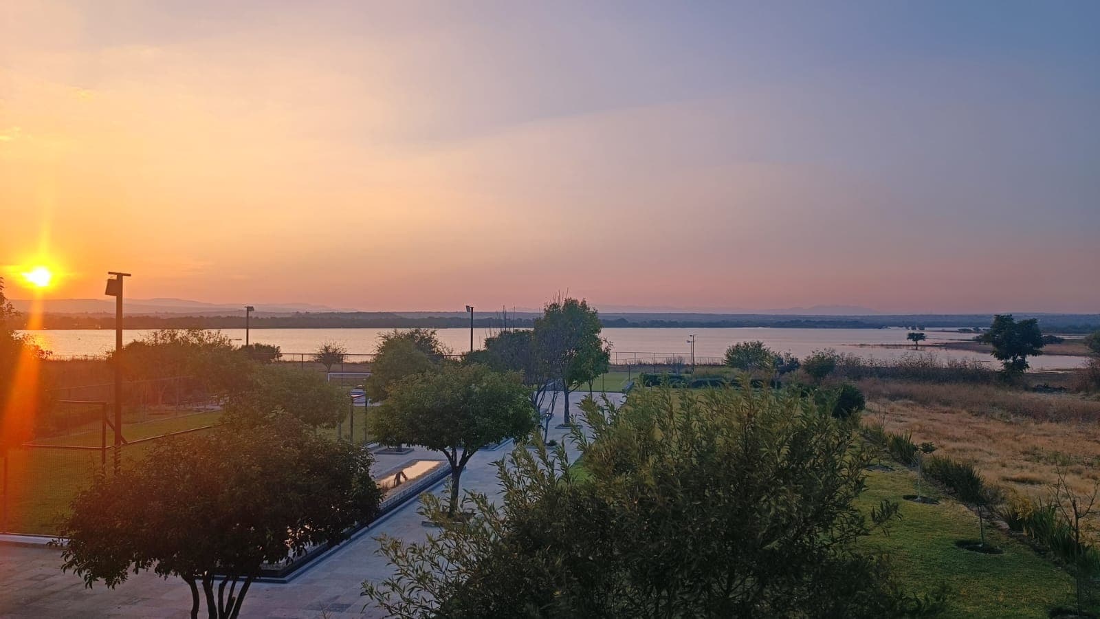 Manzana 7 Lote 46 — Las Campanas, San Miguel de Allende — photo 7 — golden sunset, serene waterfront views