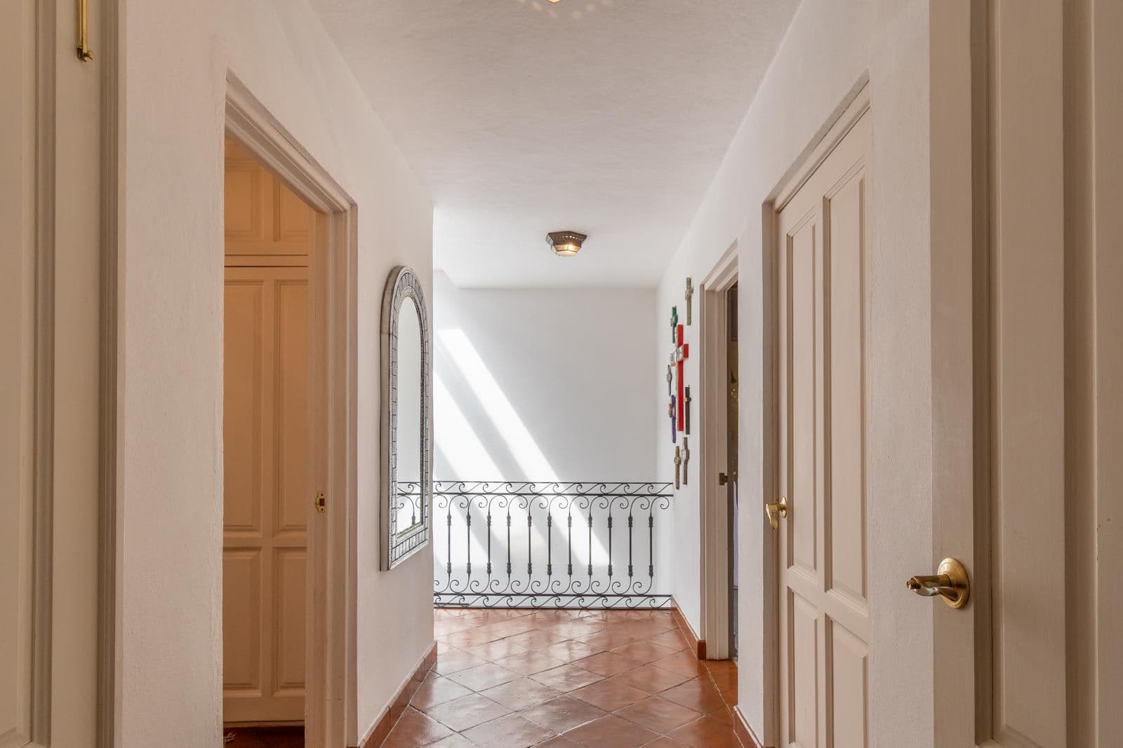 Casa Suerte — Balcones, San Miguel de Allende — photo 12 — luminous hallway, classic architectural charm