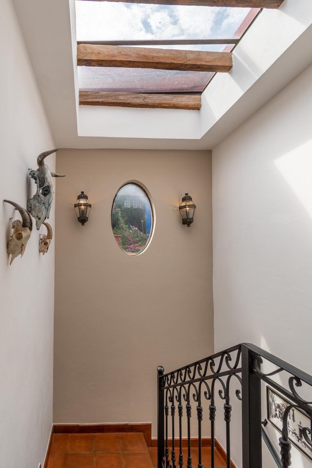 Casa Suerte — Balcones, San Miguel de Allende — photo 11 — skylighted stairwell with mountain vistas
