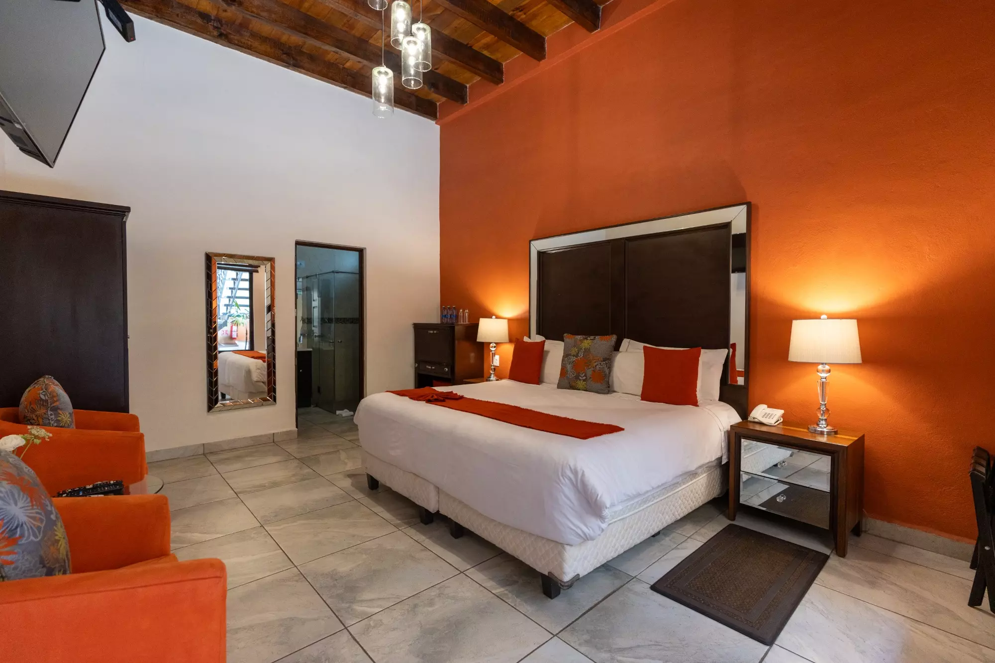 Hotel Centro — Centro, San Miguel de Allende — photo 5 — vibrant master suite with warm ambiance