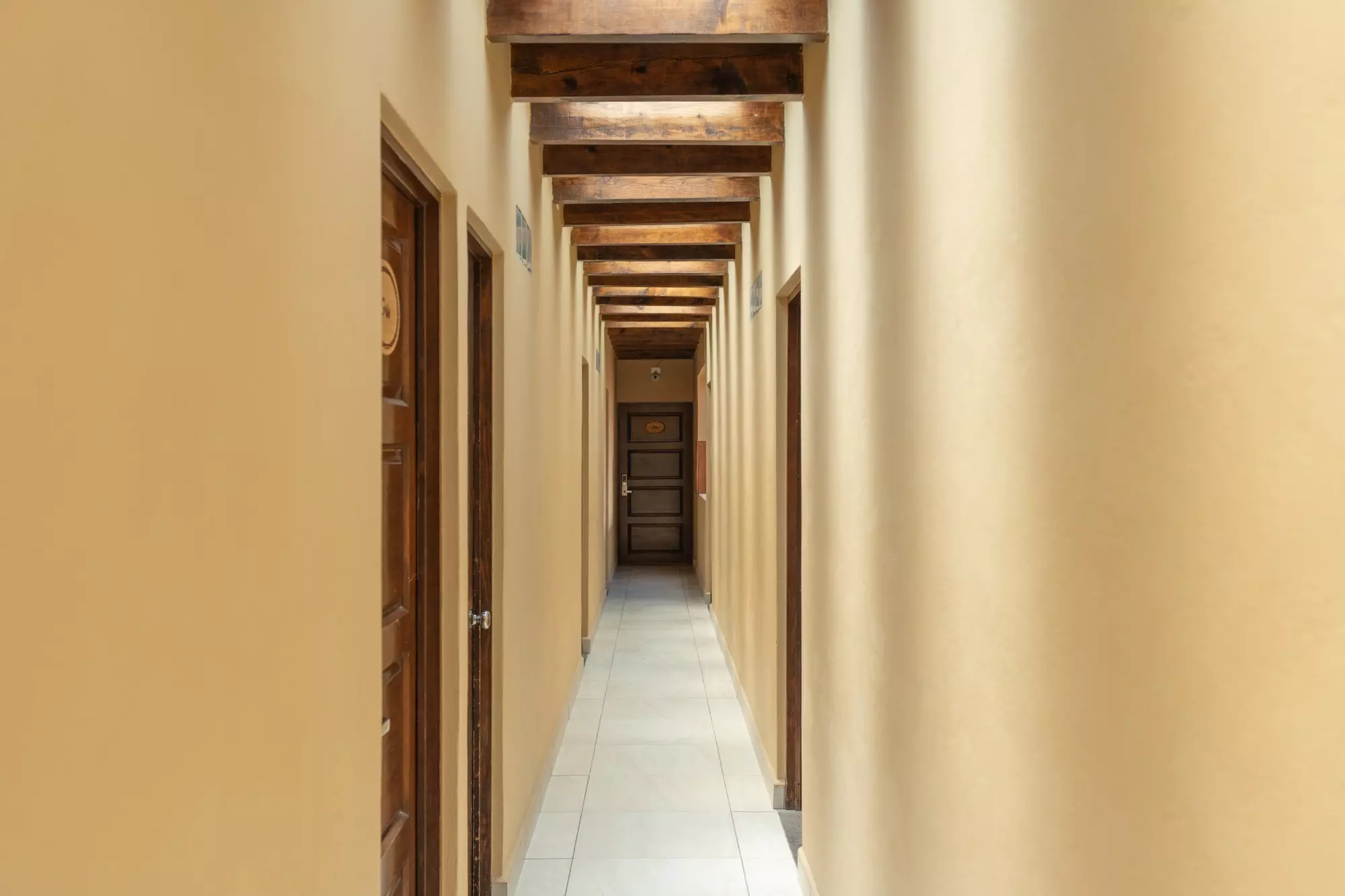 Hotel Centro — Centro, San Miguel de Allende — photo 8 — elegant colonial corridor, rustic wooden beams