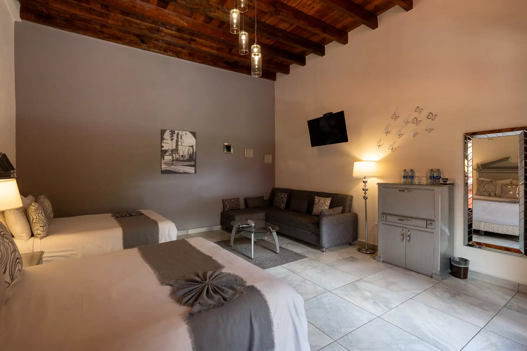 Hotel Centro — Centro, San Miguel de Allende — photo 11 — sophisticated suite with rustic wooden beams