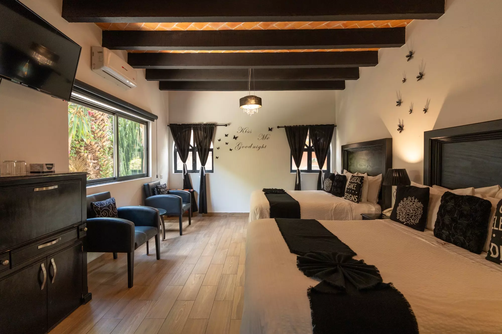 Hotel Centro — Centro, San Miguel de Allende — photo 16 — sophisticated suite with exposed beam details