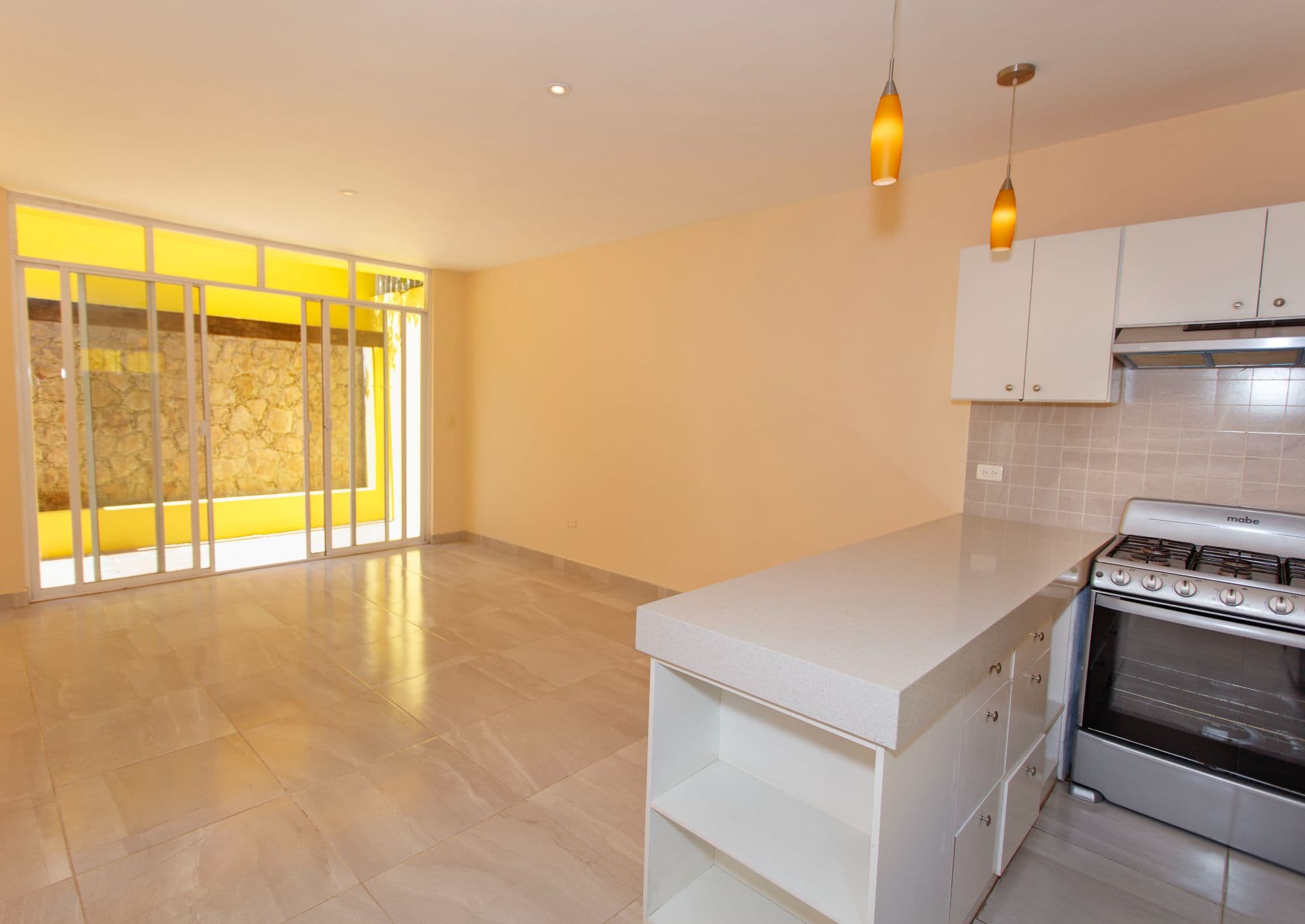 Casa Lucero 17A in La Lejona for sale in San Miguel de Allende — La Lejona, San Miguel de Allende — photo 5 — radiant kitchen with golden light embrace
