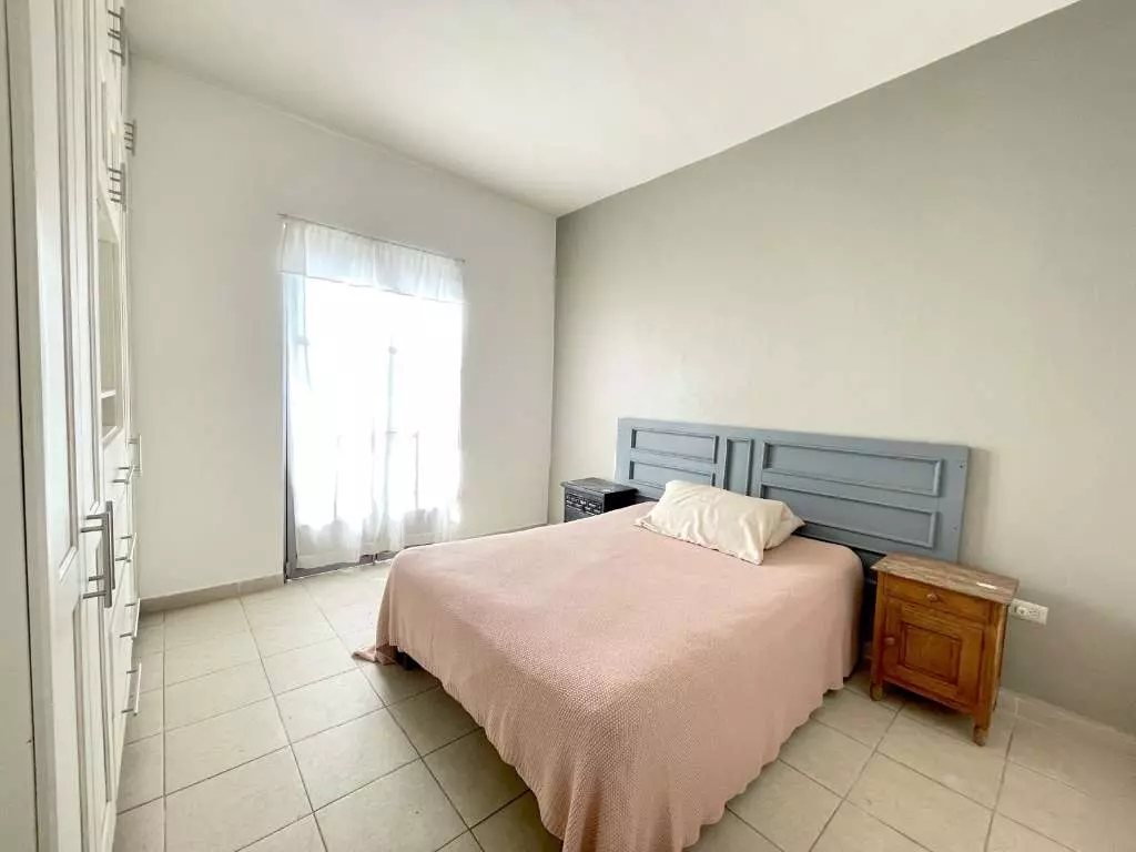 Condominio Allende — Aurora, San Miguel de Allende — photo 4 — bright, airy primary bedroom retreat