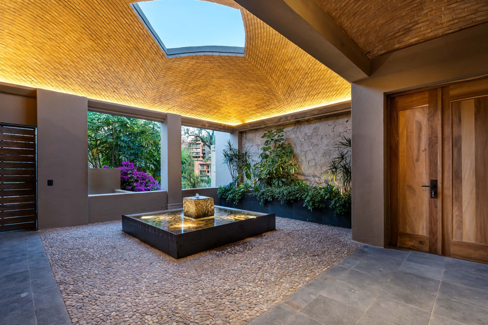 Casa Fuentes — Atascadero (Arcos de San Miguel), San Miguel de Allende — photo 2 — serene courtyard with sculptural water feature
