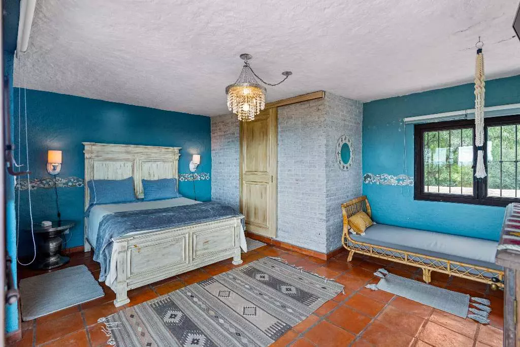Casa Roka En El Obraje — El Obraje, San Miguel de Allende — photo 4 — vibrant turquoise bedroom with colonial charm