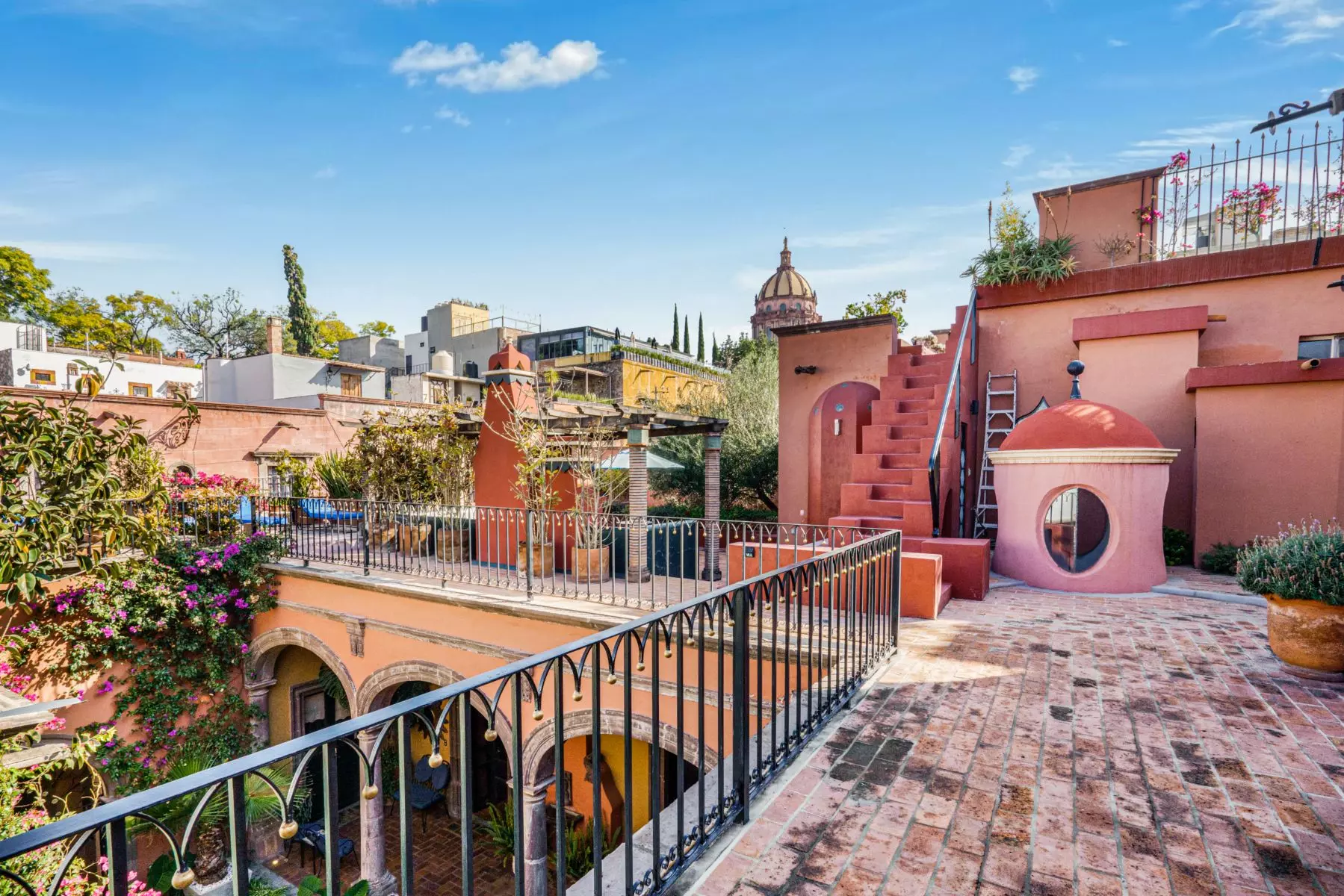 Casa de la Canal — Centro, San Miguel de Allende — photo 3 — charming rooftop terrace, colonial architecture, vibrant bougainvillea