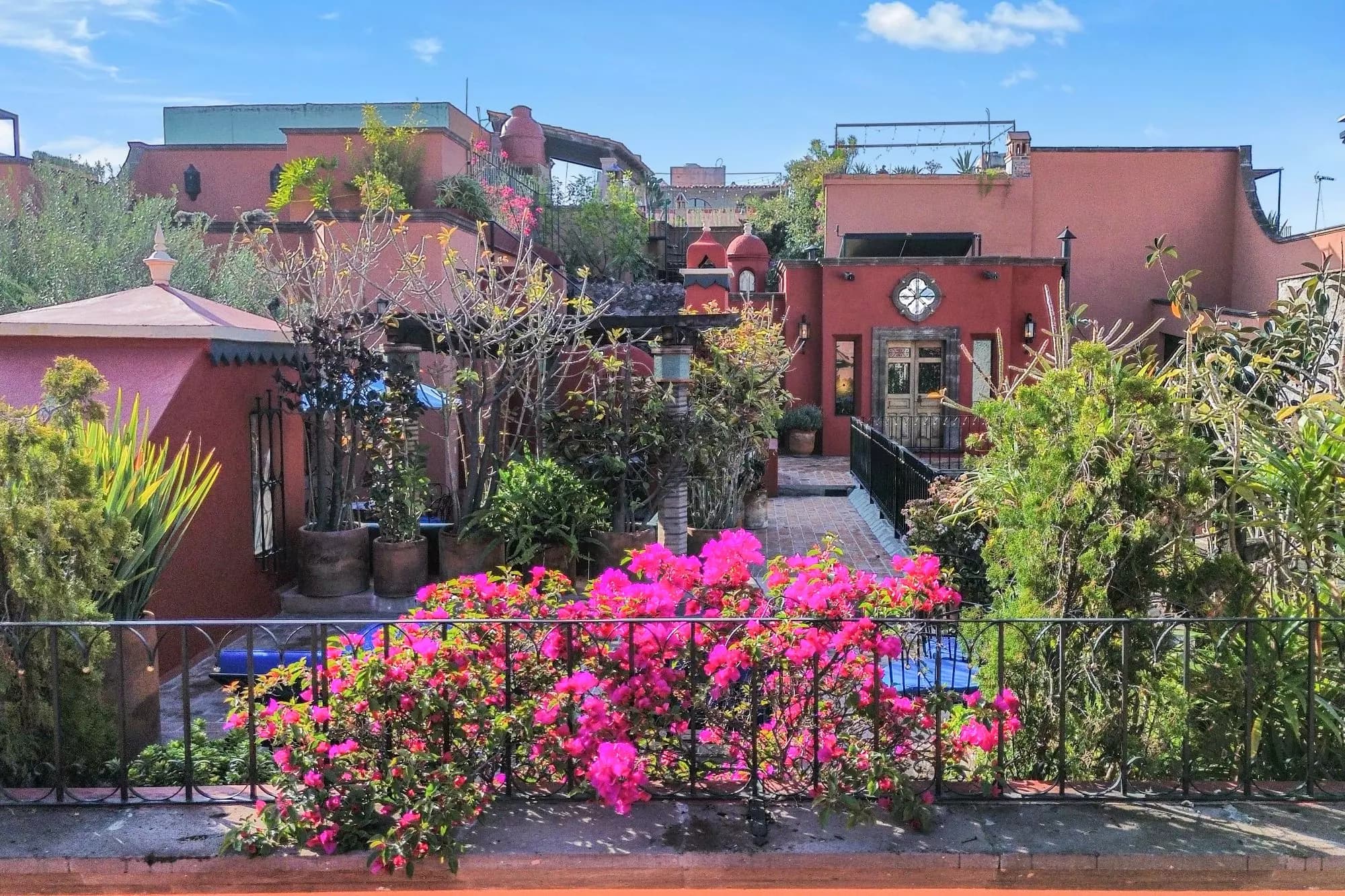 Casa de la Canal — Centro, San Miguel de Allende — photo 11 — vibrant courtyard, blooming bougainvillea paradise