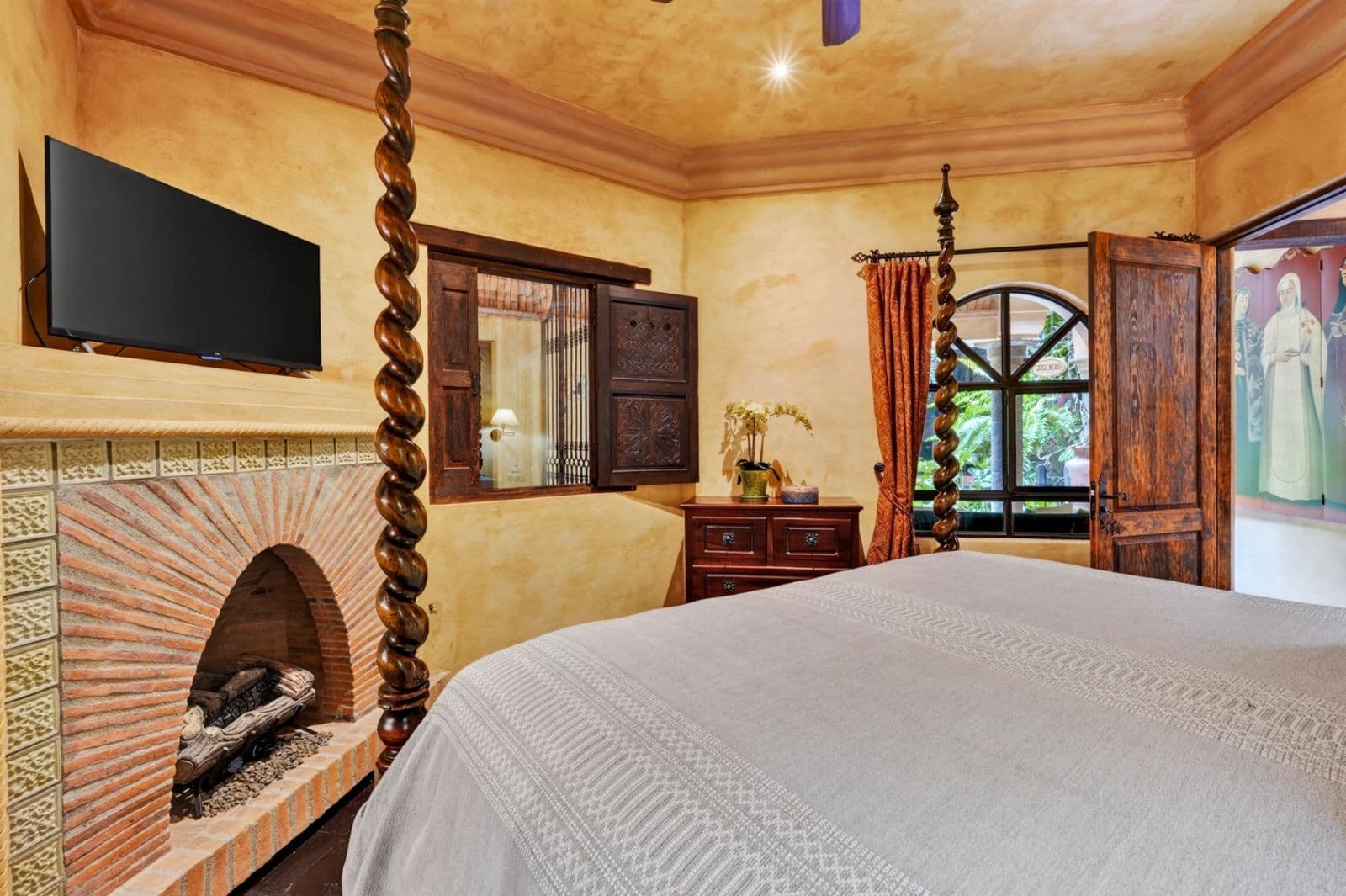 Villa Escondida — Centro, San Miguel de Allende — photo 13 — rustic luxury master suite fireplace