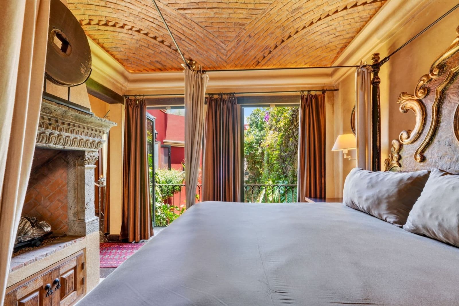 Villa Escondida — Centro, San Miguel de Allende — photo 21 — elegant bedroom, herringbone ceiling, garden views