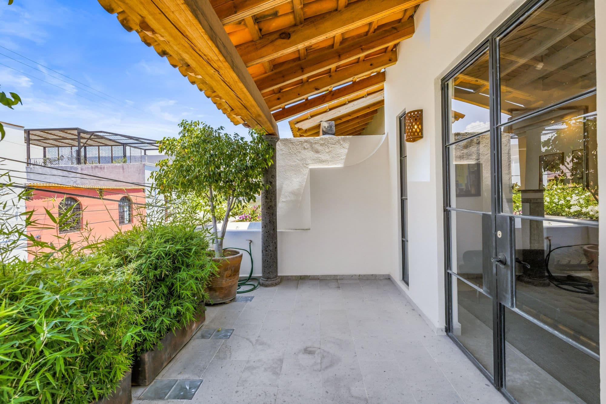 CASA PINO — Guadalupe, San Miguel de Allende — photo 20 — serene terrace with exposed wooden beams