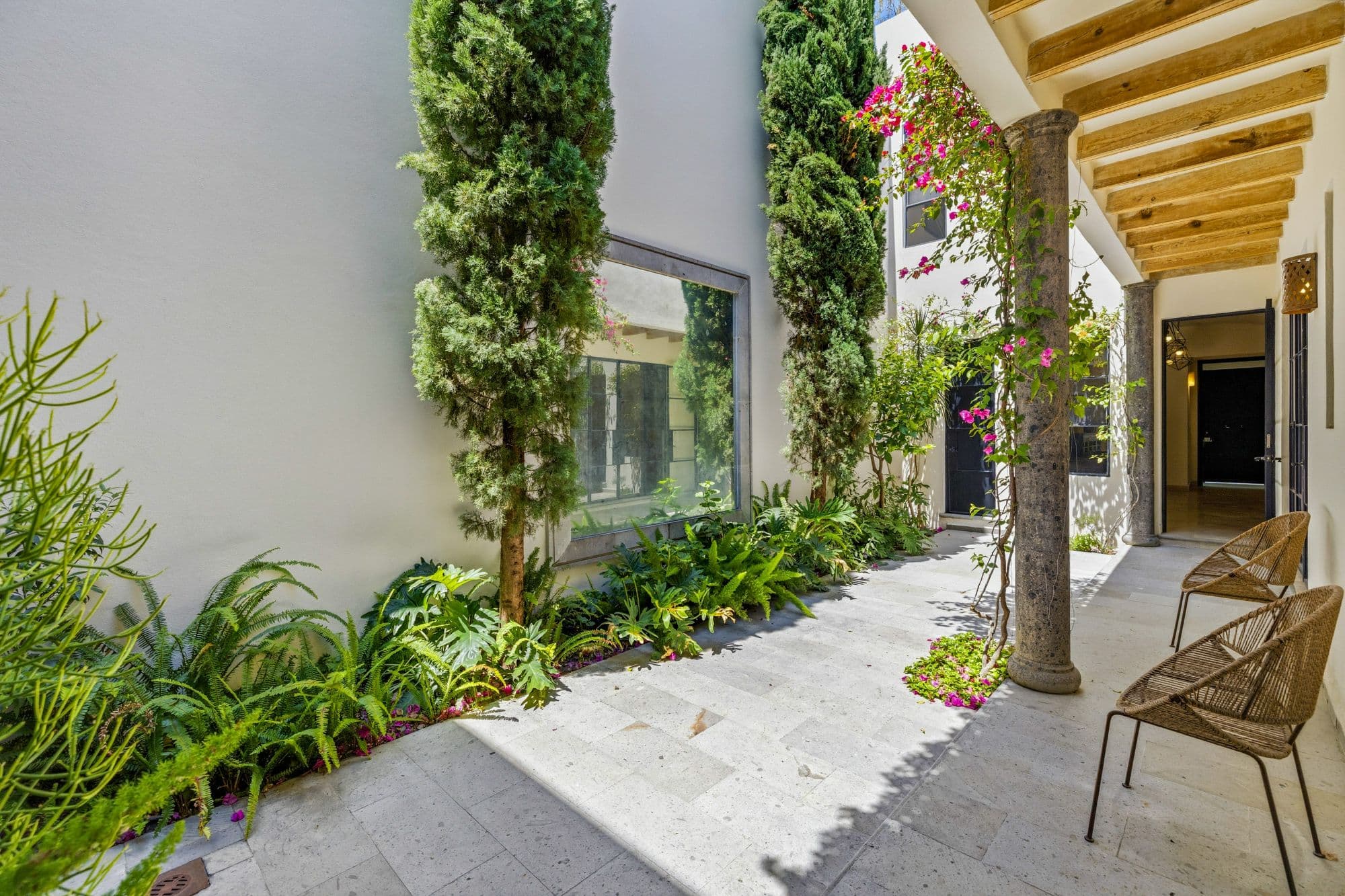 CASA PINO — Guadalupe, San Miguel de Allende — photo 6 — verdant courtyard with soaring beams