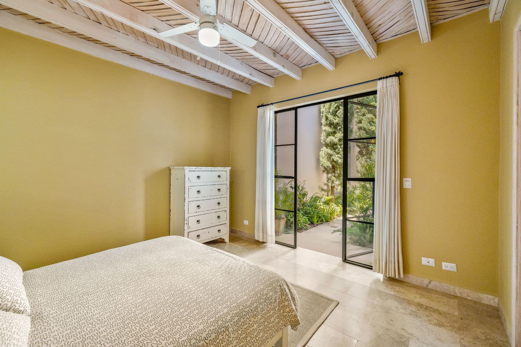 CASA PINO — Guadalupe, San Miguel de Allende — photo 8 — sunlit bedroom with garden views