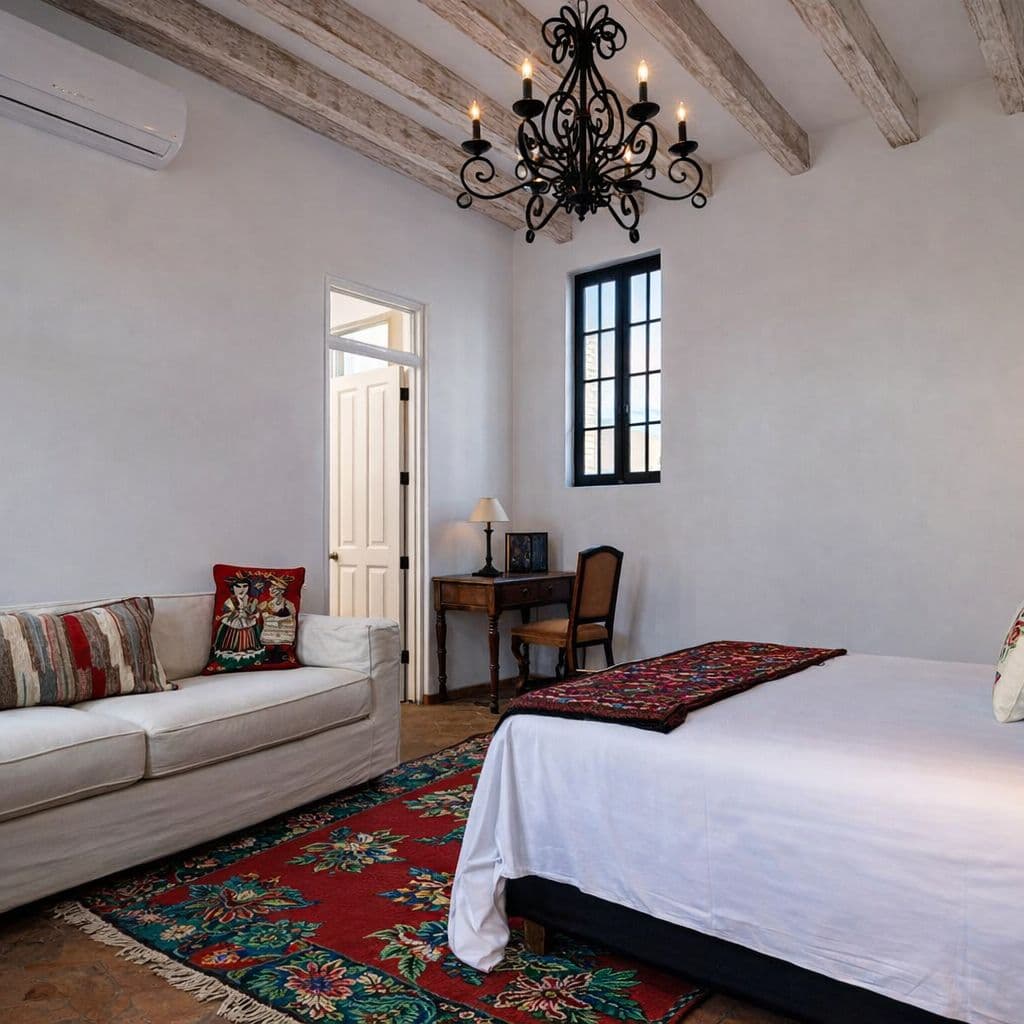 Breathtaking Casa Blanca — Guadiana, San Miguel de Allende — photo 34 — elegant colonial bedroom with rustic beams