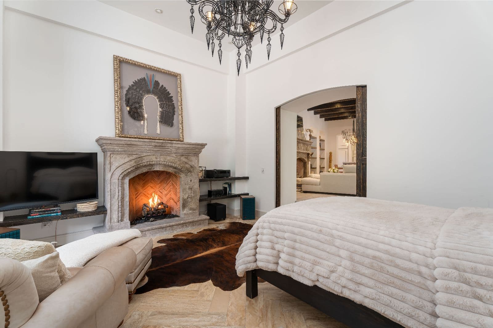 Casa Santa Mónica — Centro, San Miguel de Allende — photo 9 — luxurious primary suite, glowing fireplace warmth