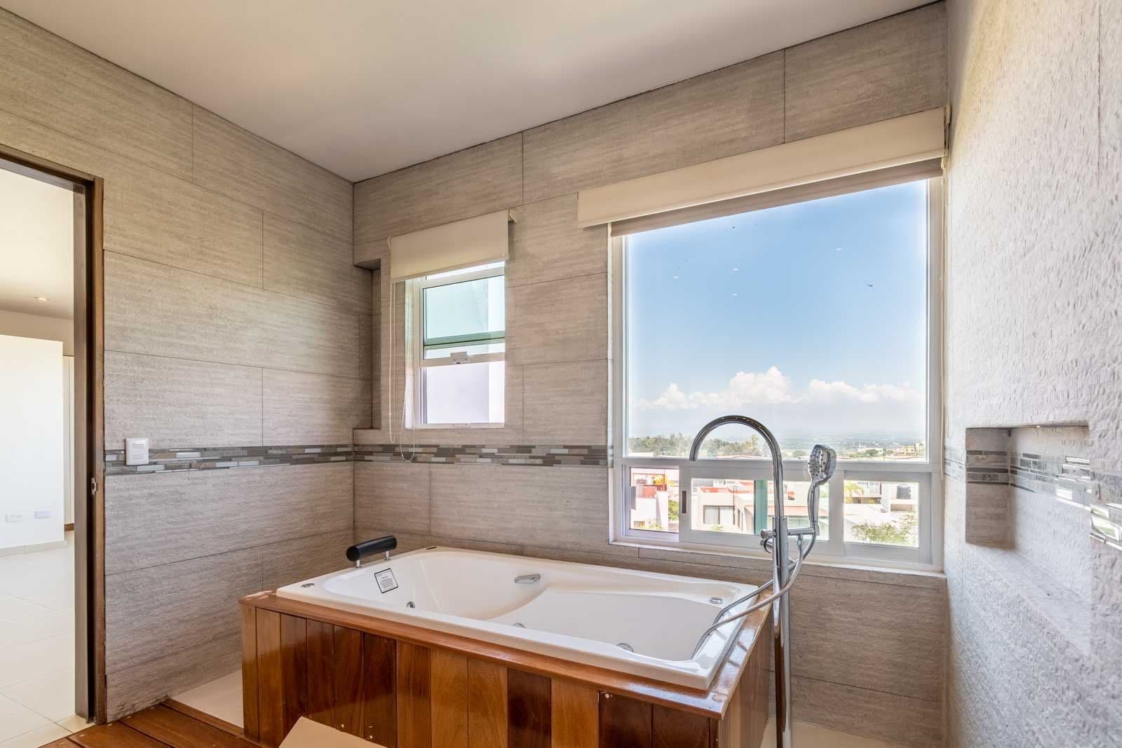 Casa Verona — El Capricho, San Miguel de Allende — photo 13 — spa-like soaking tub with panoramic views