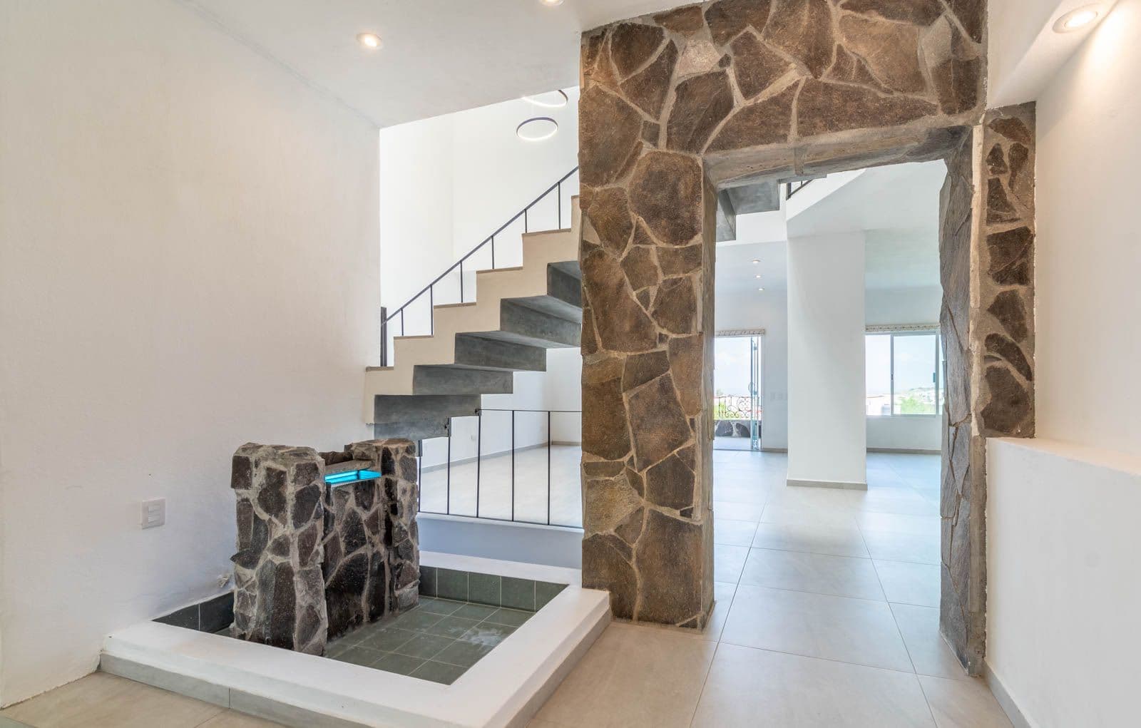Casa Verona — El Capricho, San Miguel de Allende — photo 2 — contemporary stone entry with soaring light