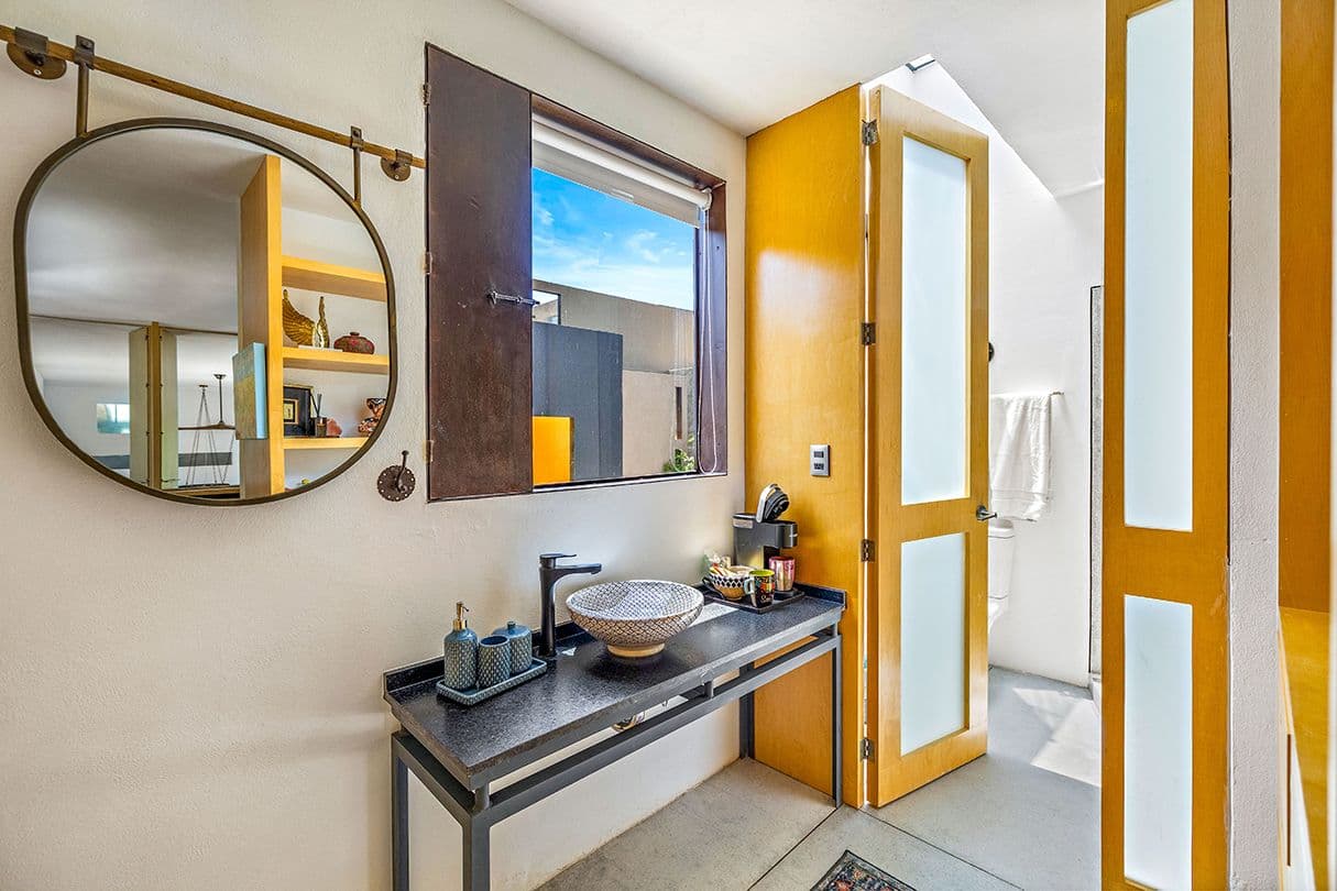 Casa 19 — Centro, San Miguel de Allende — photo 19 — sunlit contemporary bathroom with artisanal details