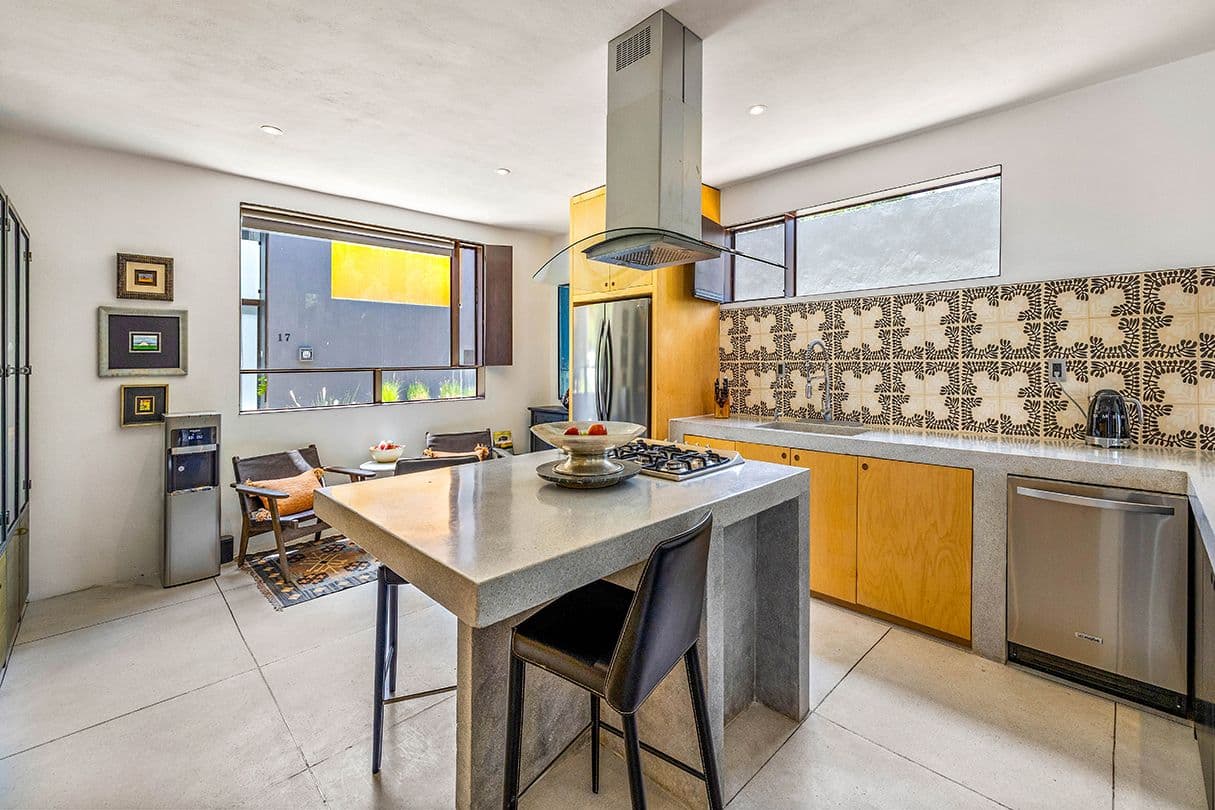 Casa 19 — Centro, San Miguel de Allende — photo 7 — contemporary kitchen with golden accents, natural light