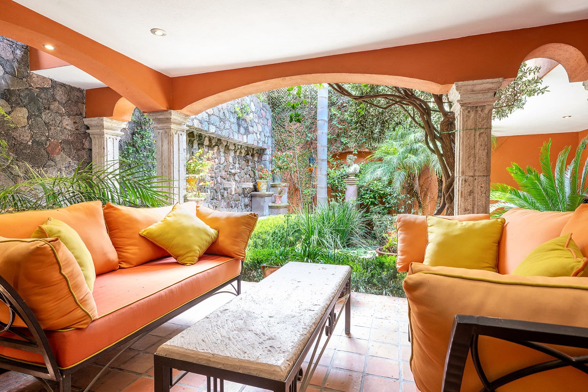 Casa Del Encanto — Guadiana, San Miguel de Allende — photo 21 — vibrant colonial courtyard with mature gardens