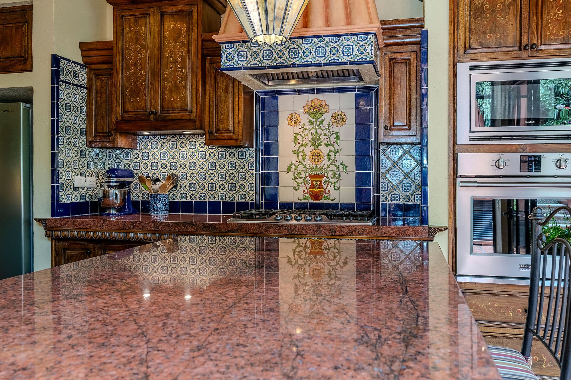 Casa Del Encanto — Guadiana, San Miguel de Allende — photo 13 — artisan kitchen with hand-painted tiles