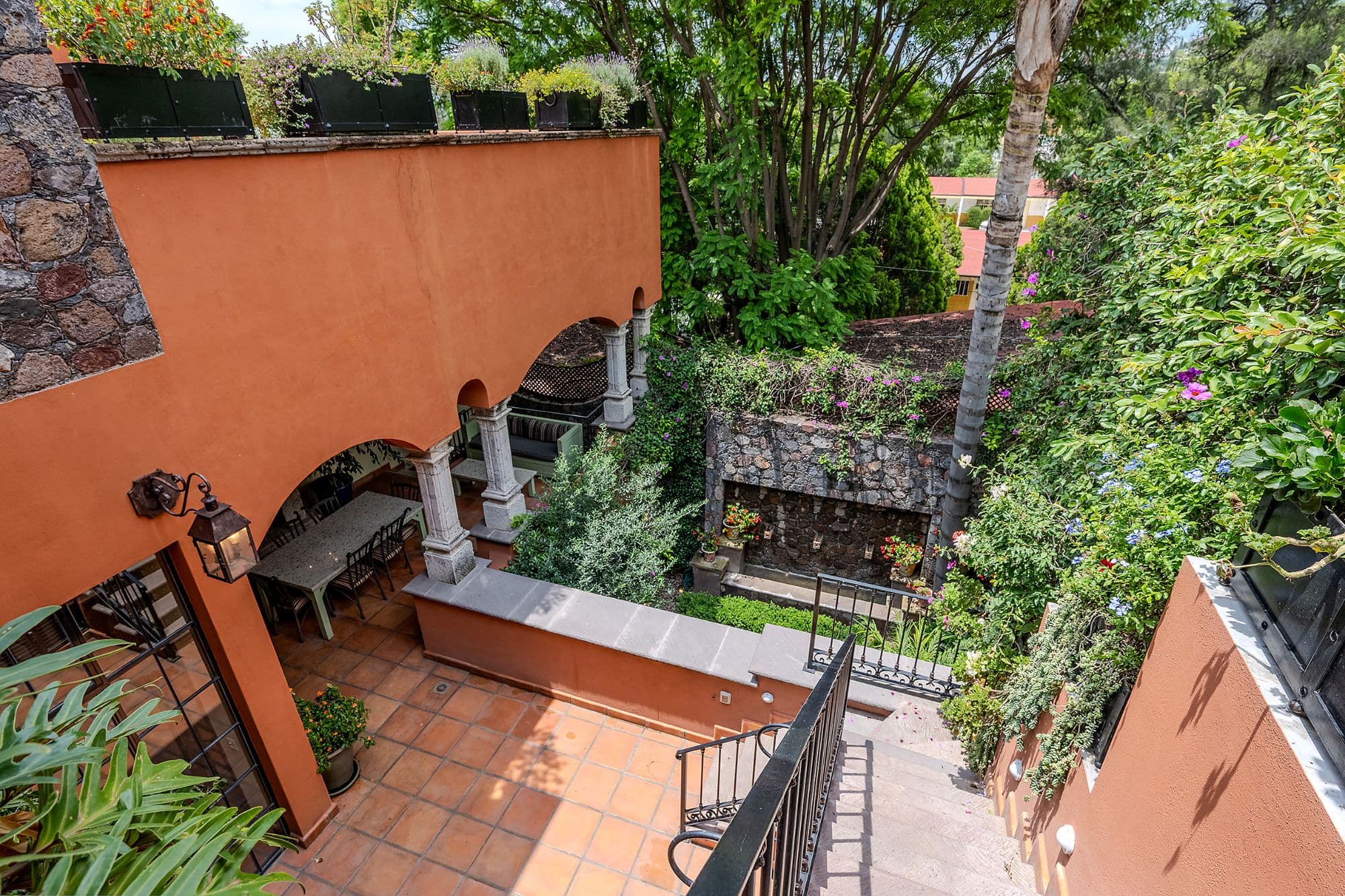 Casa Del Encanto — Guadiana, San Miguel de Allende — photo 17 — verdant courtyard with mexican architectural charm