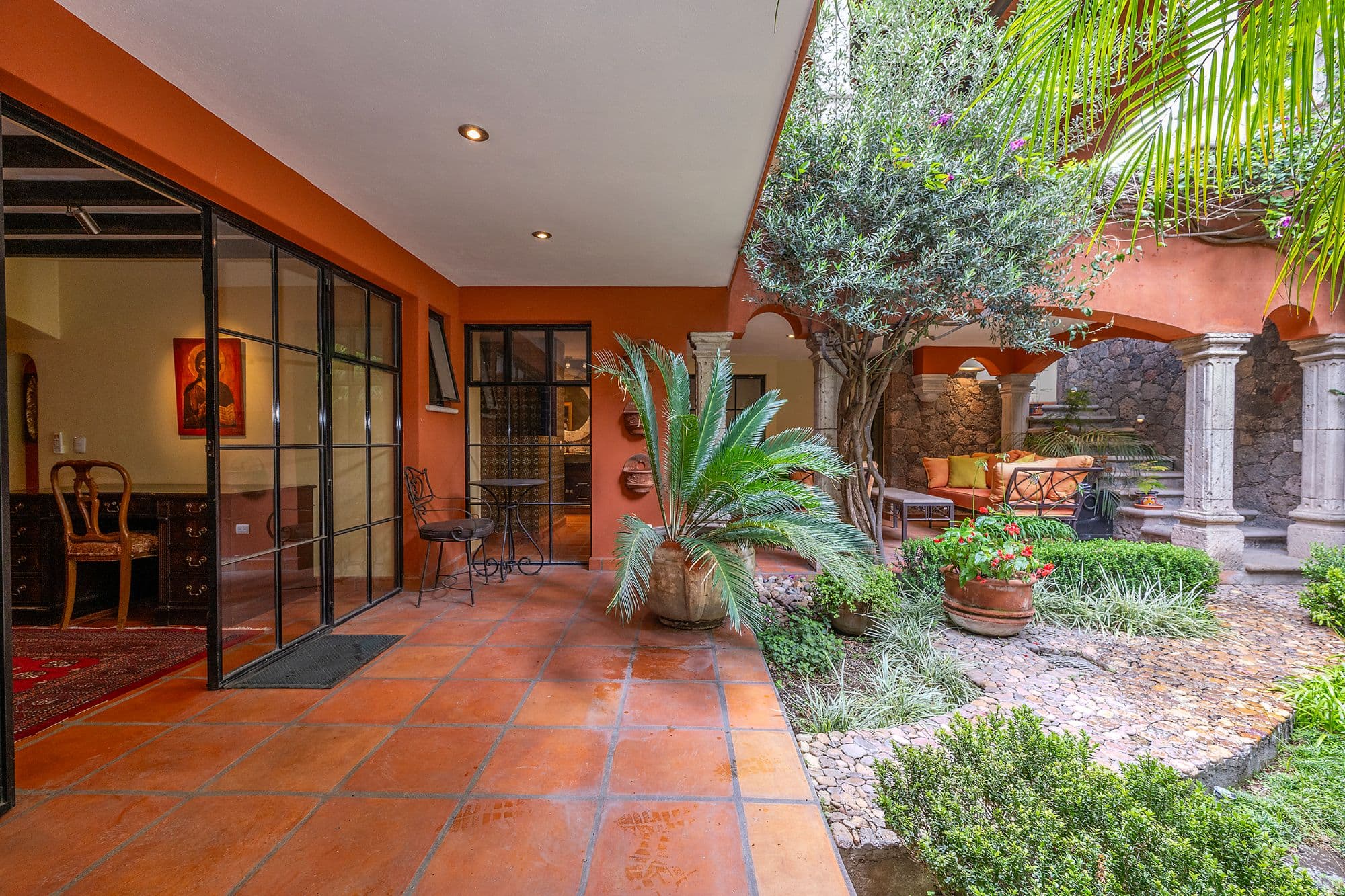 Casa Del Encanto — Guadiana, San Miguel de Allende — photo 25 — vibrant colonial courtyard with mature gardens
