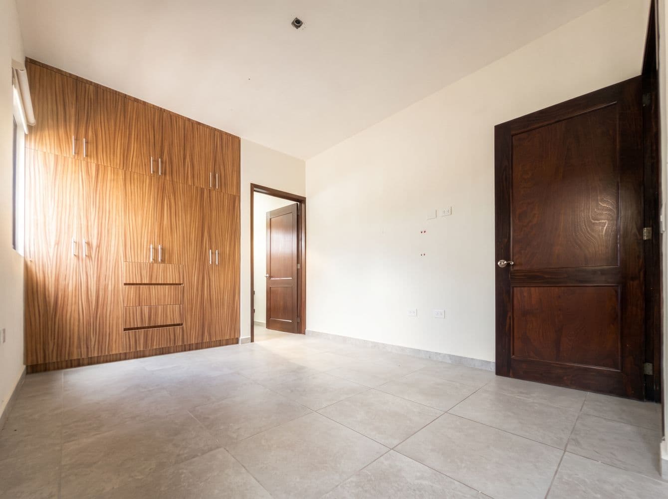 Casa Maple — Centro, San Miguel de Allende — photo 6 — luminous master suite, elegant wood cabinetry