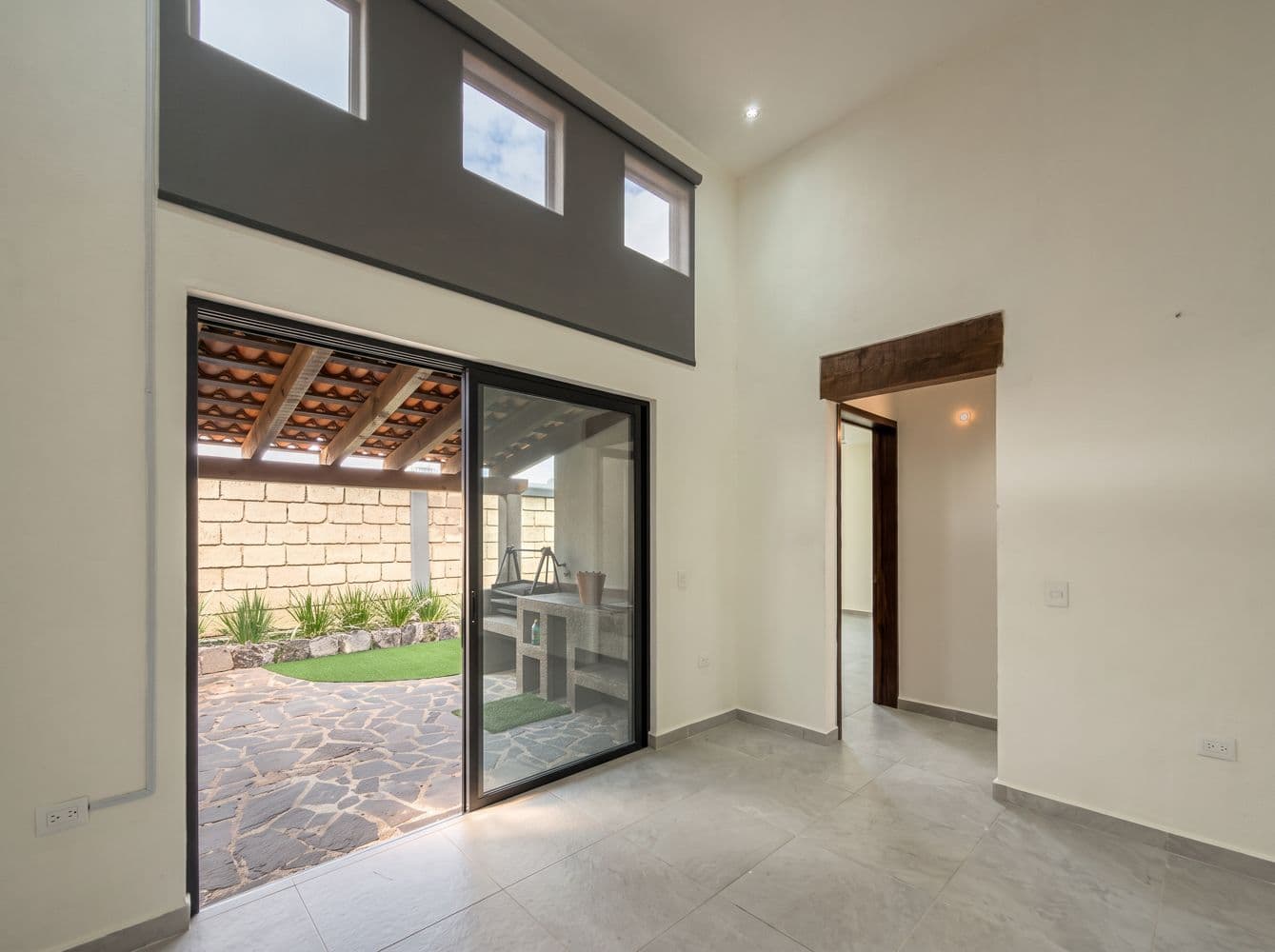 Casa Maple — Centro, San Miguel de Allende — photo 15 — luminous living space opens to garden