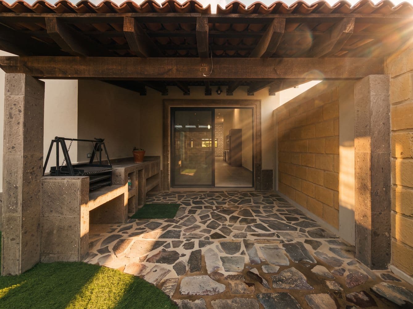 Casa Maple — Centro, San Miguel de Allende — photo 24 — golden sunlit courtyard, rustic stone elegance