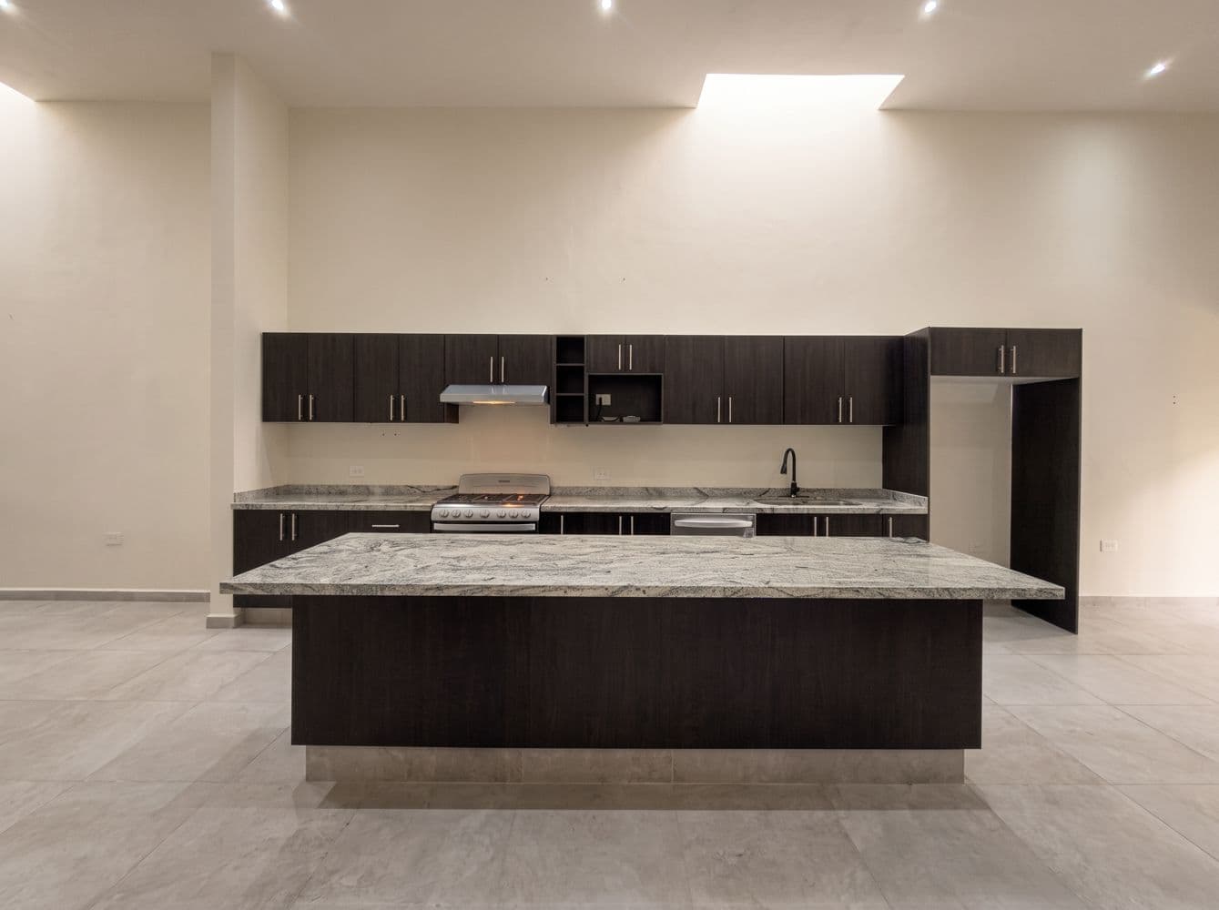 Casa Maple — Centro, San Miguel de Allende — photo 14 — contemporary chef's kitchen, radiant skylight