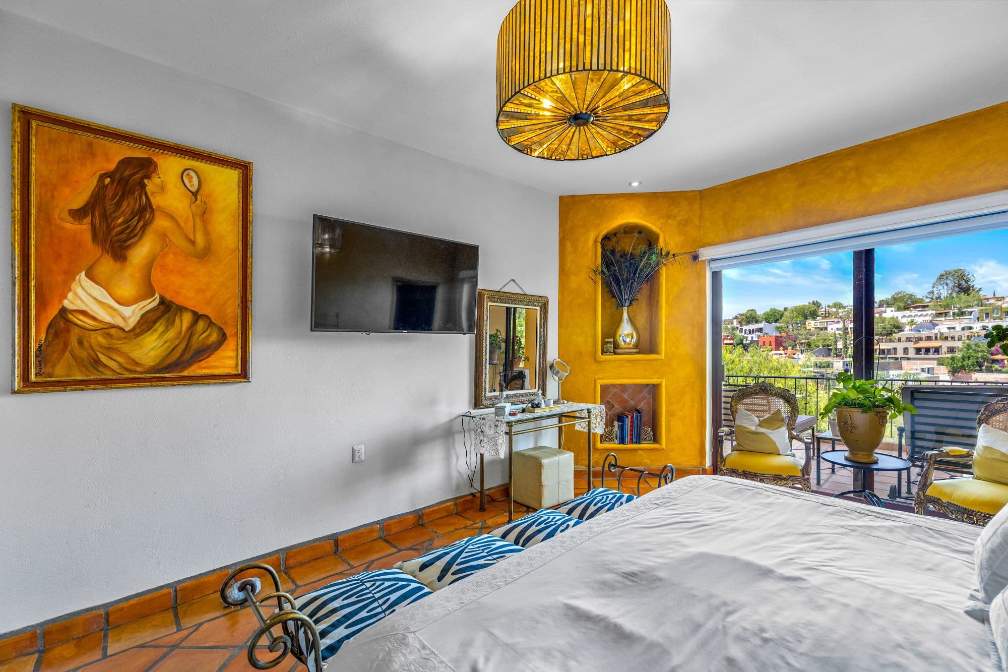 Condo Girasoles — San Miguel de Allende Centro, San Miguel de Allende — photo 8 — vibrant master suite with panoramic city views