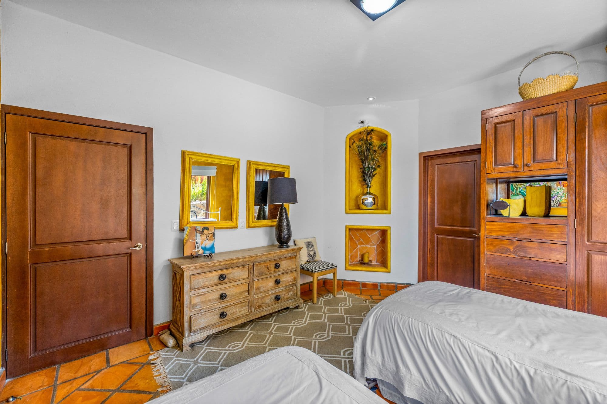 Condo Girasoles — San Miguel de Allende Centro, San Miguel de Allende — photo 10 — elegant bedroom with warm wood finishes
