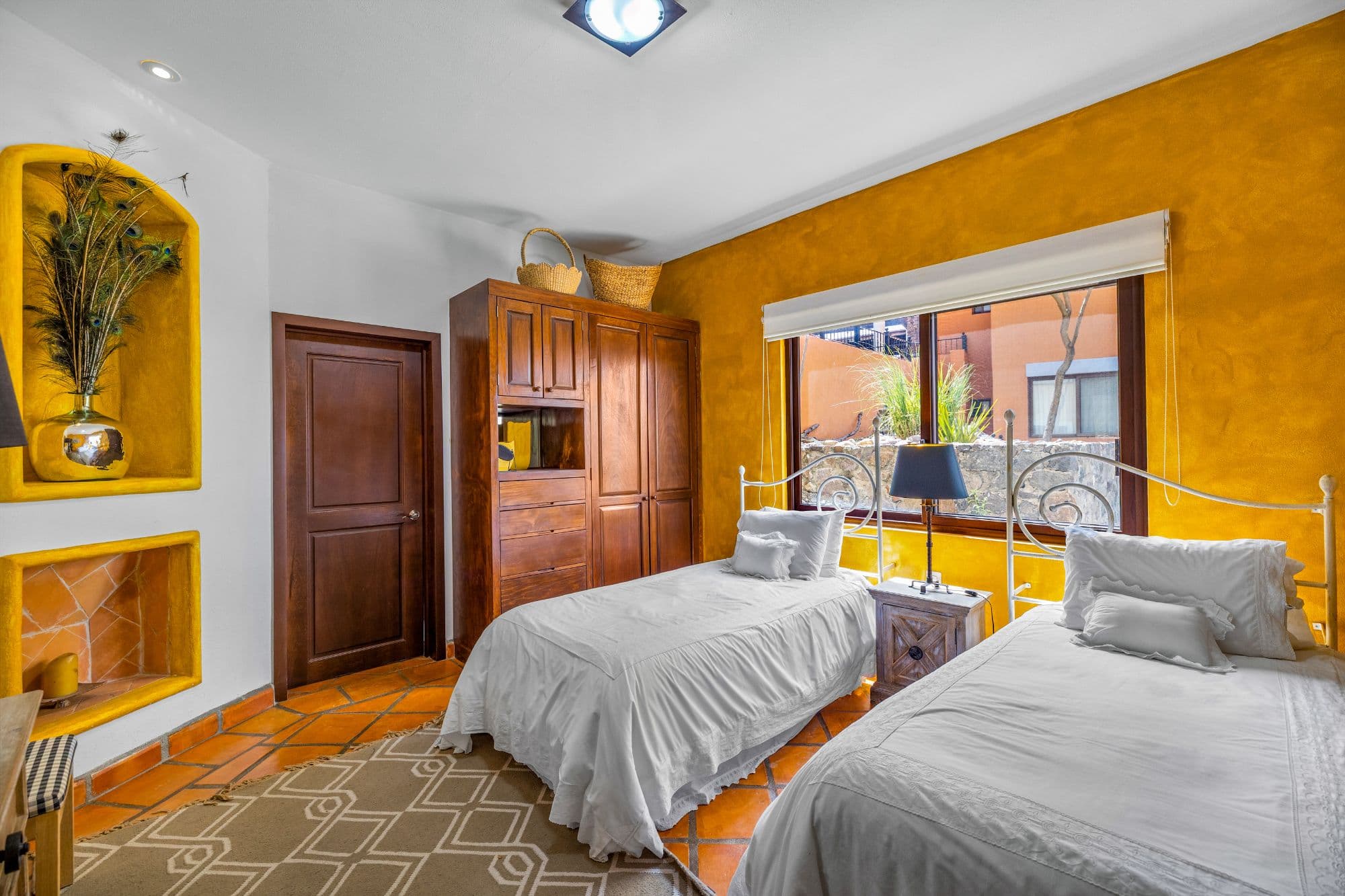 Condo Girasoles — San Miguel de Allende Centro, San Miguel de Allende — photo 12 — vibrant bedroom with spectacular terrace views