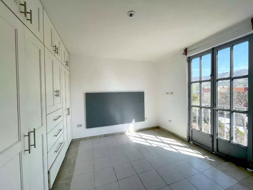 Condominio Info Allende — Aurora, San Miguel de Allende — photo 7 — luminous master suite with panoramic vistas