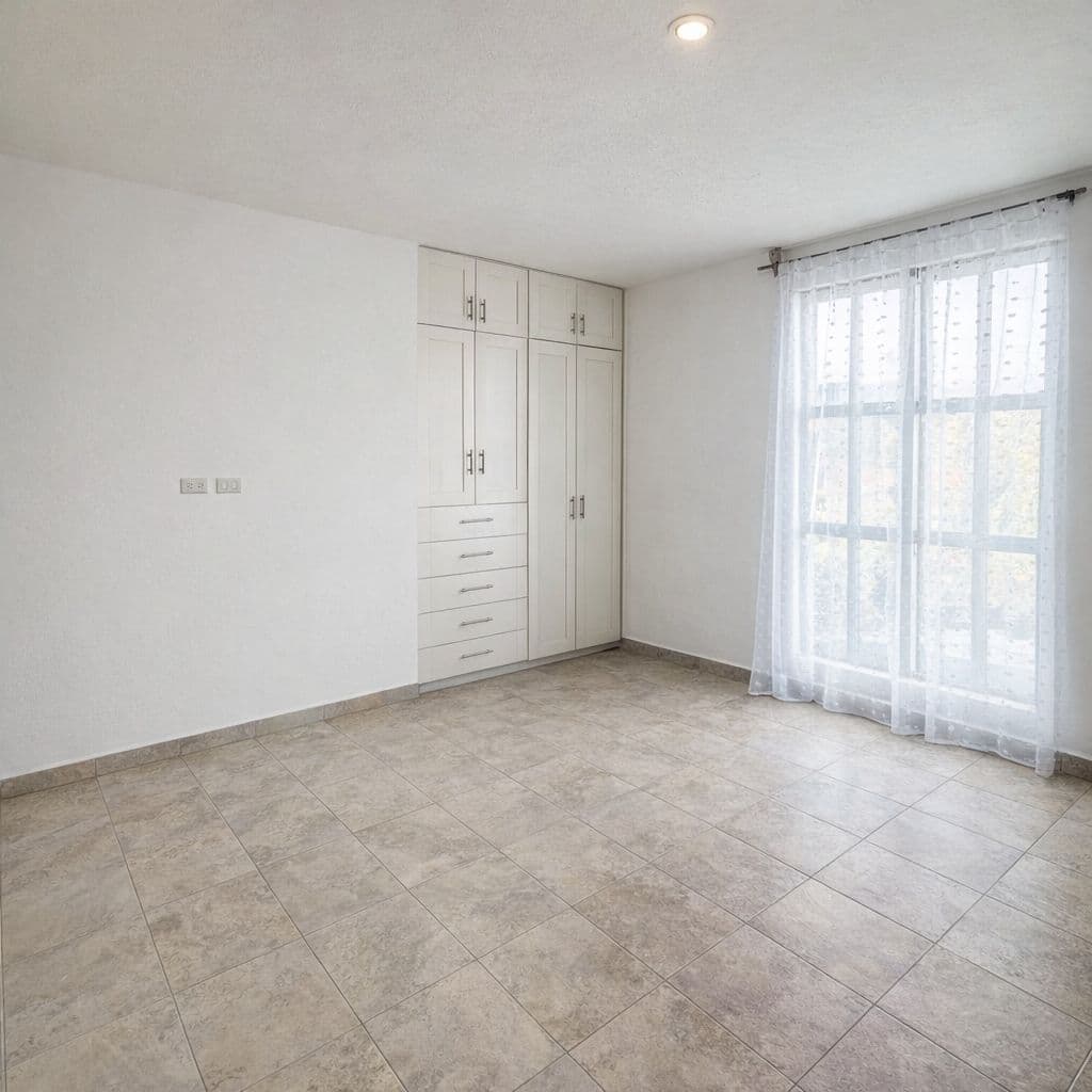 Condominio Info Allende — Aurora, San Miguel de Allende — photo 6 — luminous bedroom with built-in wardrobes