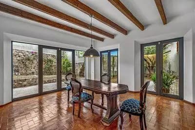 Casa Bamboo — Ojo de Agua, San Miguel de Allende — photo 8 — elegant dining with soaring timber beams