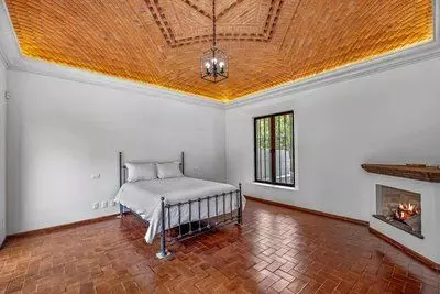 Casa Bamboo — Ojo de Agua, San Miguel de Allende — photo 15 — serene bedroom, soaring wooden ceilings
