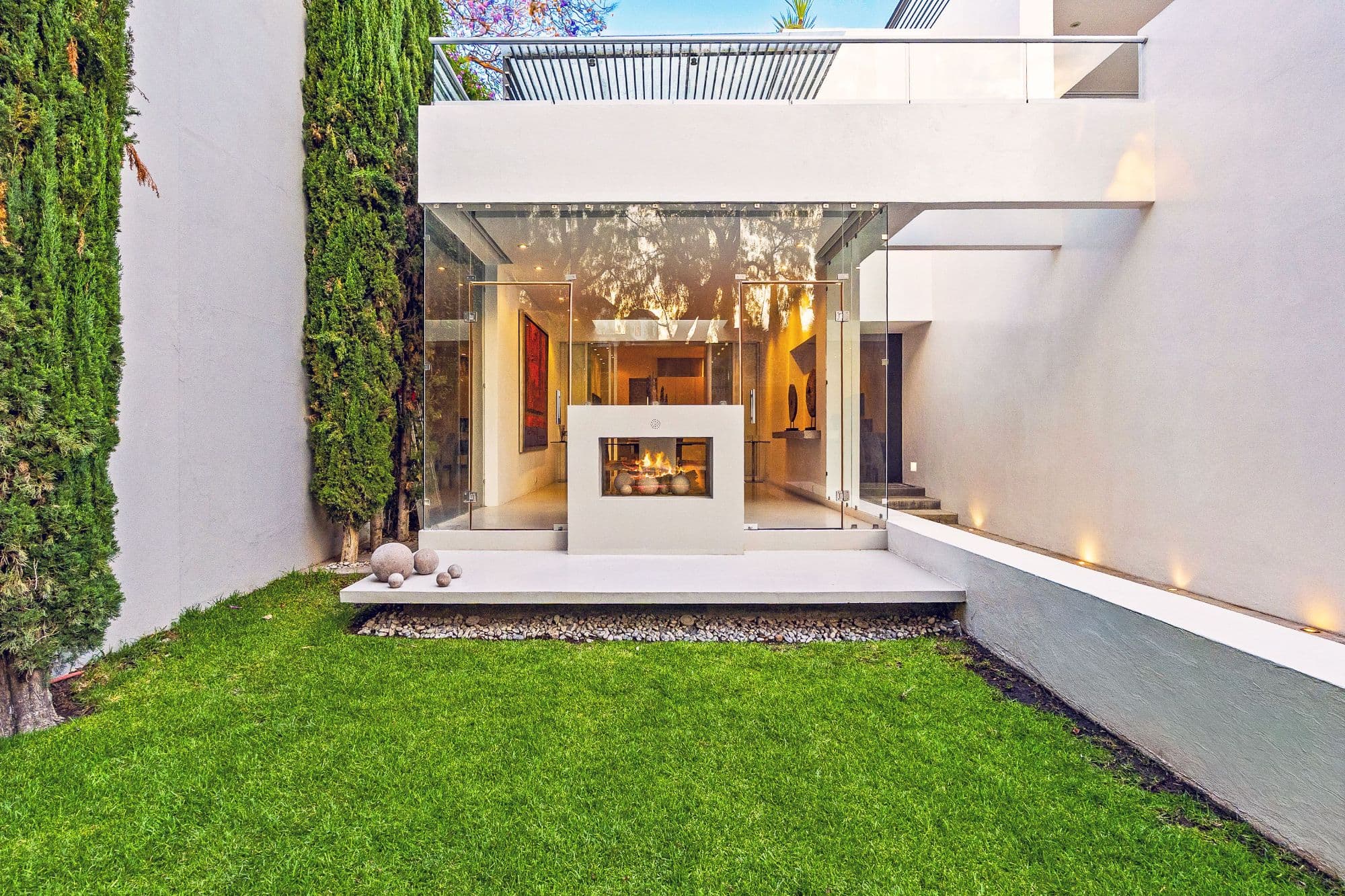 Casa Kent — Centro, San Miguel de Allende — photo 5 — contemporary courtyard with glowing fireplace elegance