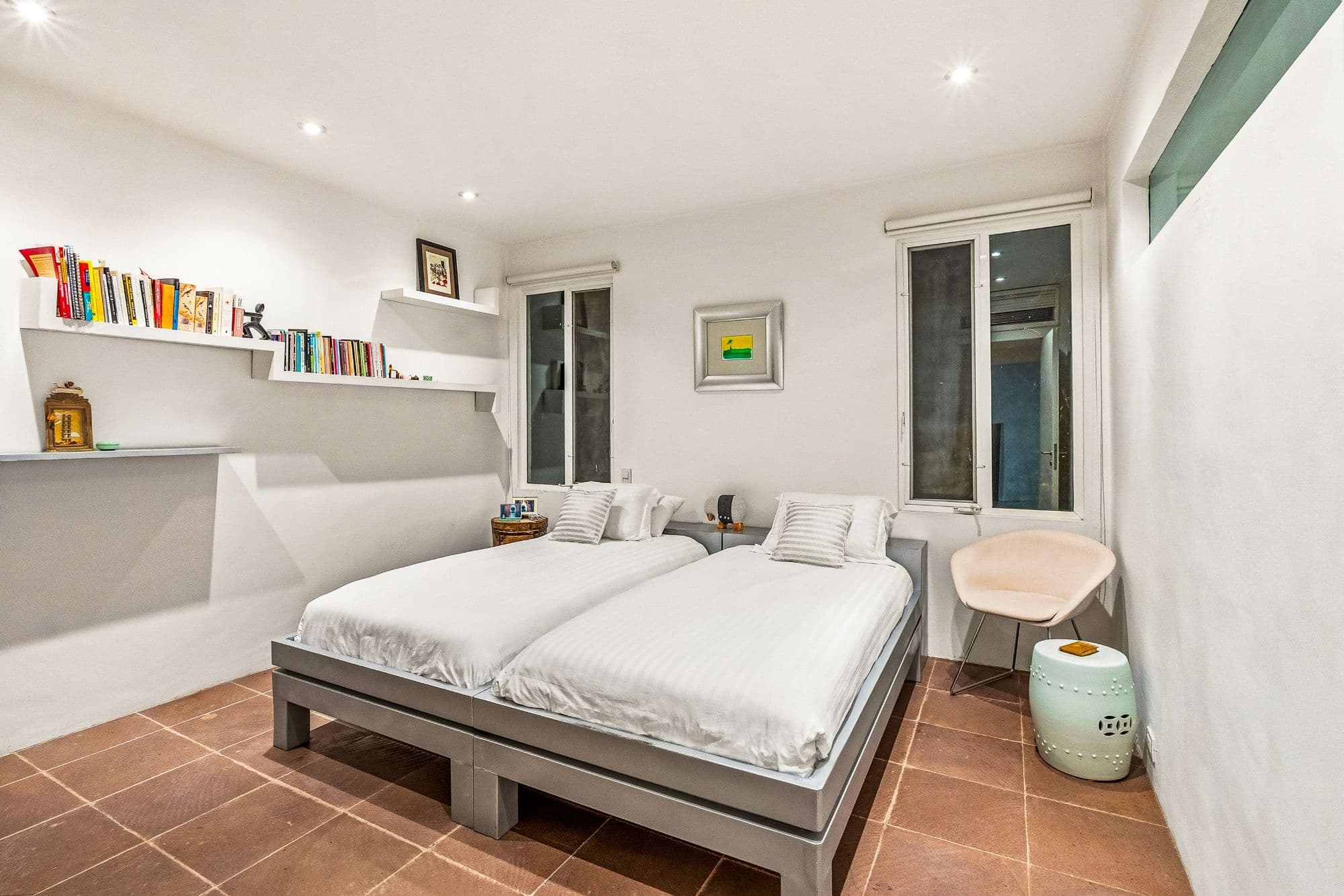 Casa Kent — Centro, San Miguel de Allende — photo 17 — bright, minimalist bedroom with terracotta floors